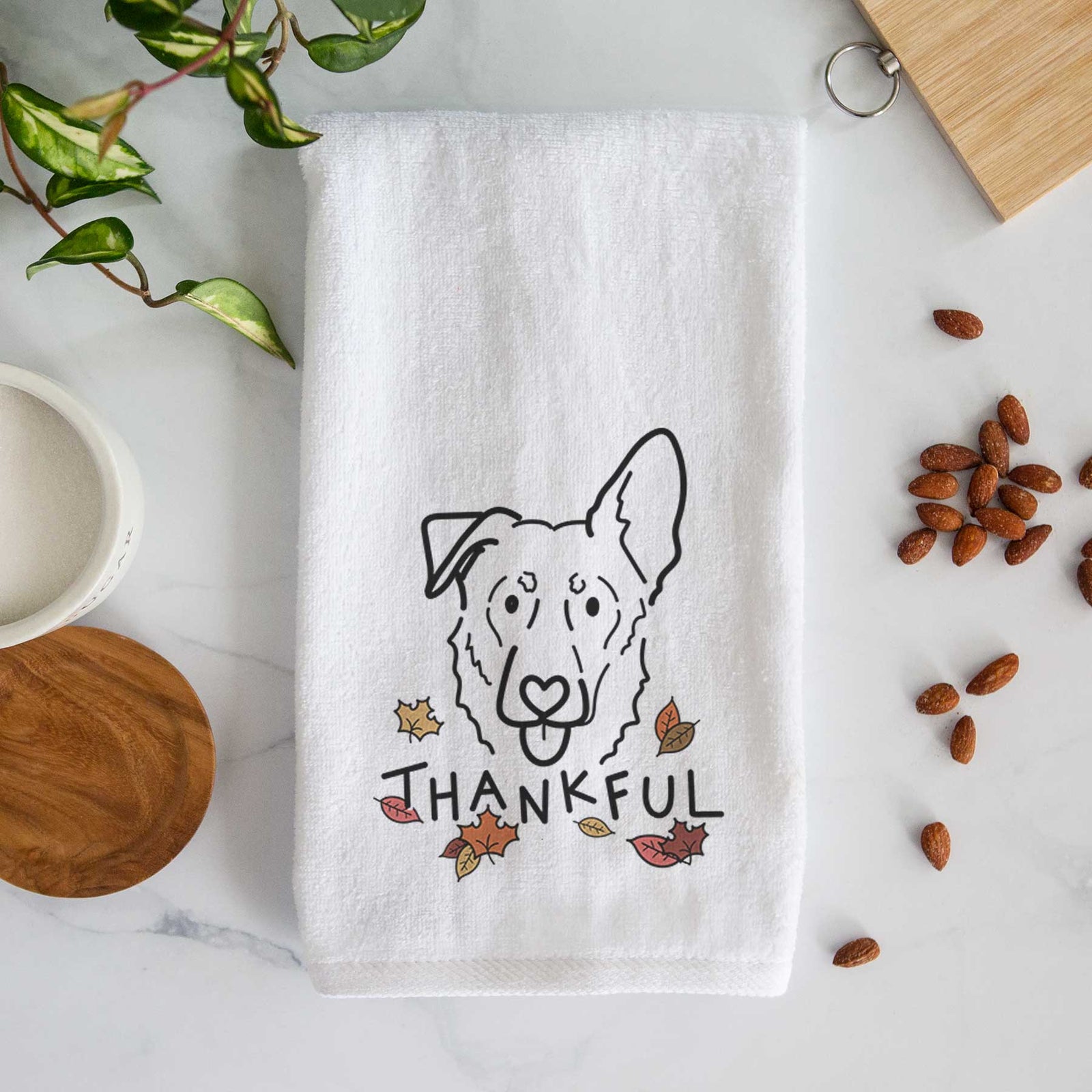 Minimalist line drawing of Bodhi the Shepherd Mix with 'Thankful' lettering on a decorative hand towel