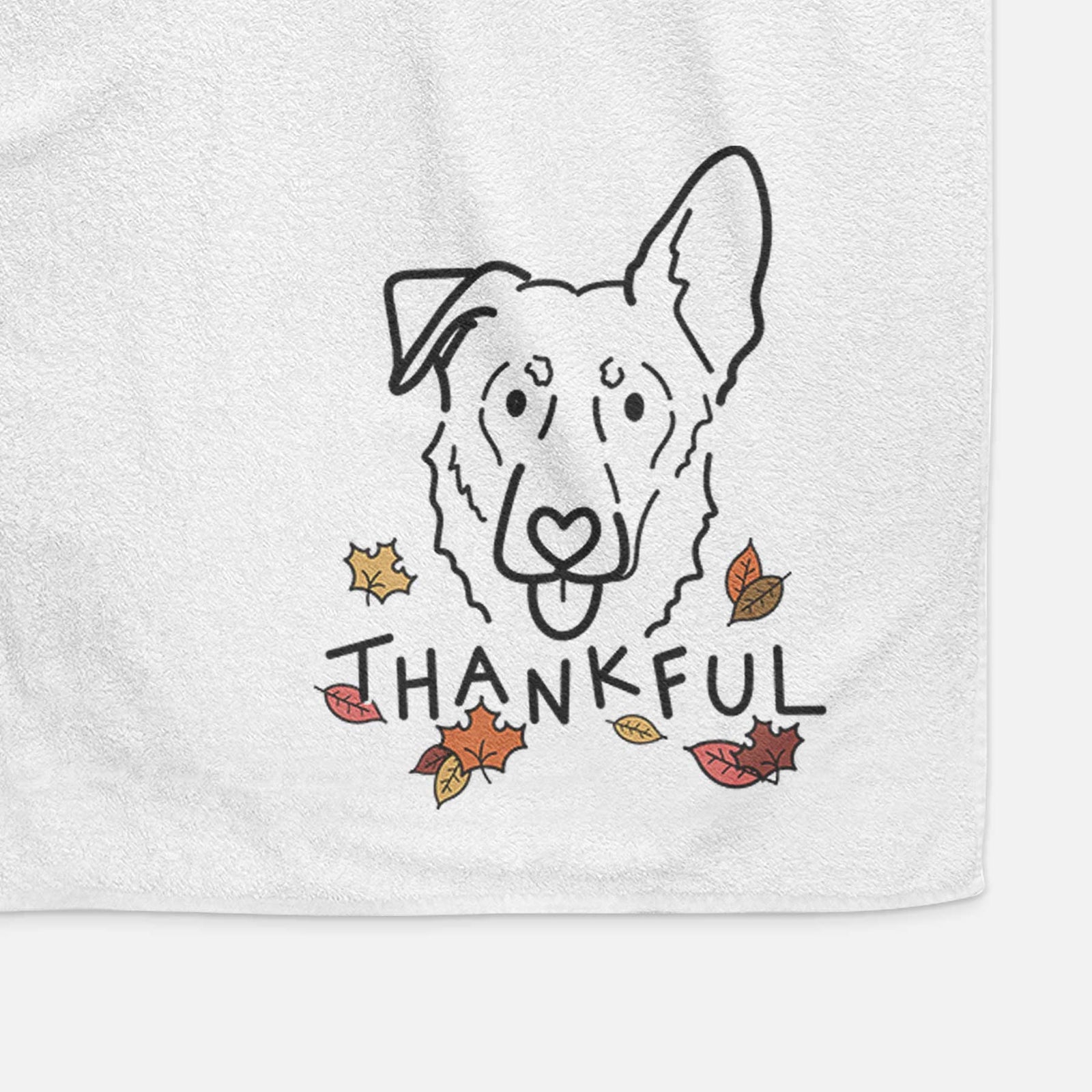 Minimalist line drawing of Bodhi the Shepherd Mix with 'Thankful' lettering on a decorative hand towel