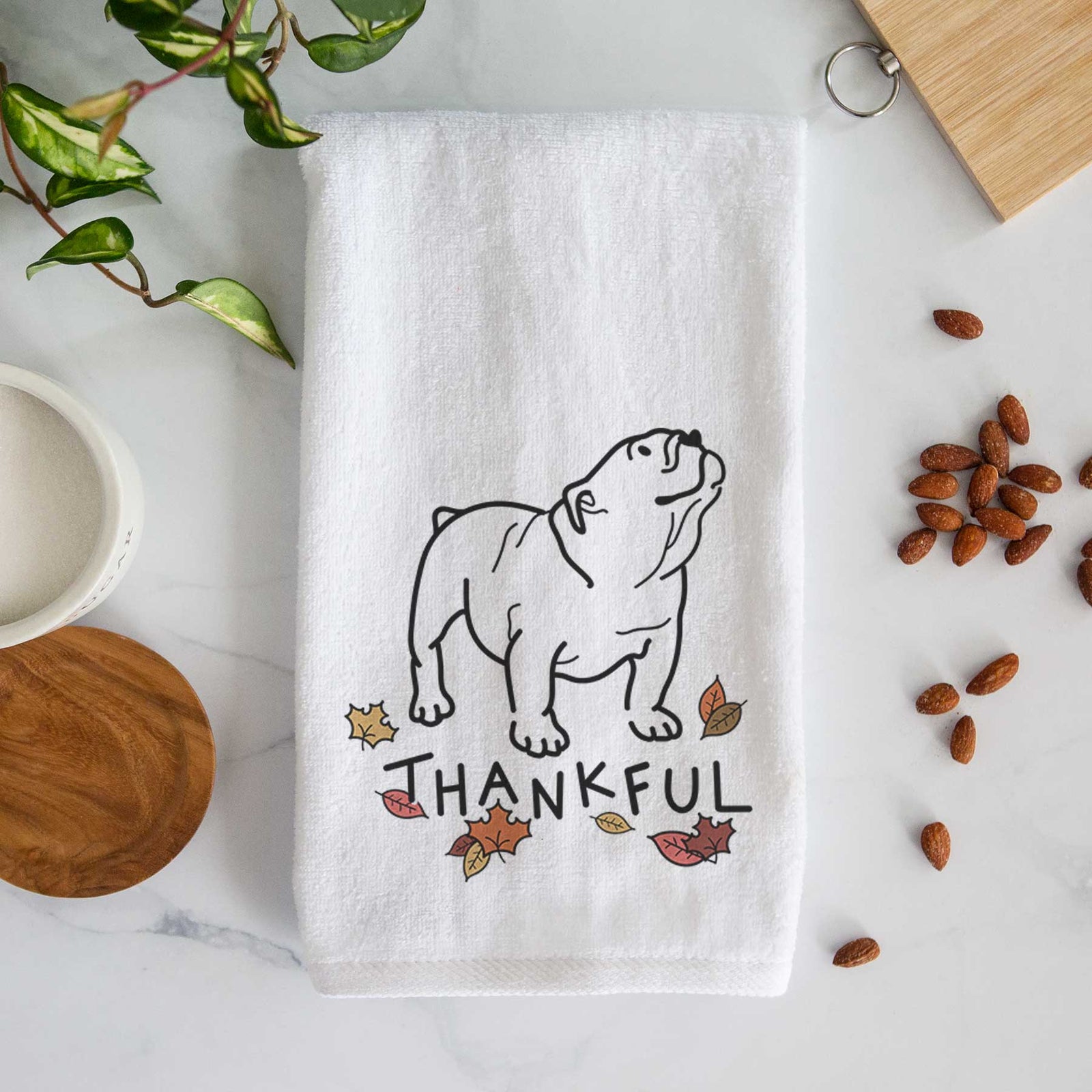 Minimalist line drawing of Bruno the English Bulldog with 'Thankful' lettering on a decorative hand towel