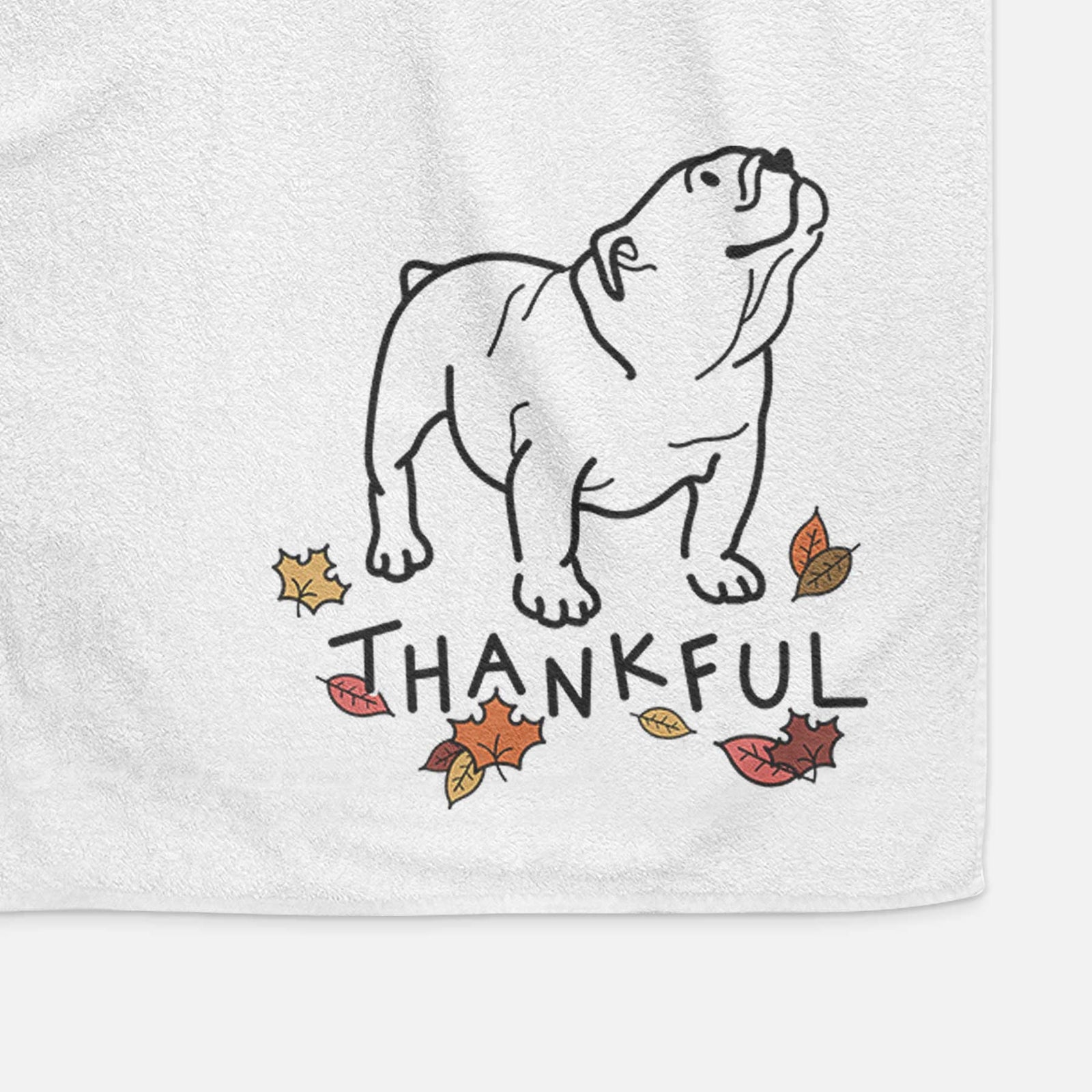 Minimalist line drawing of Bruno the English Bulldog with 'Thankful' lettering on a decorative hand towel