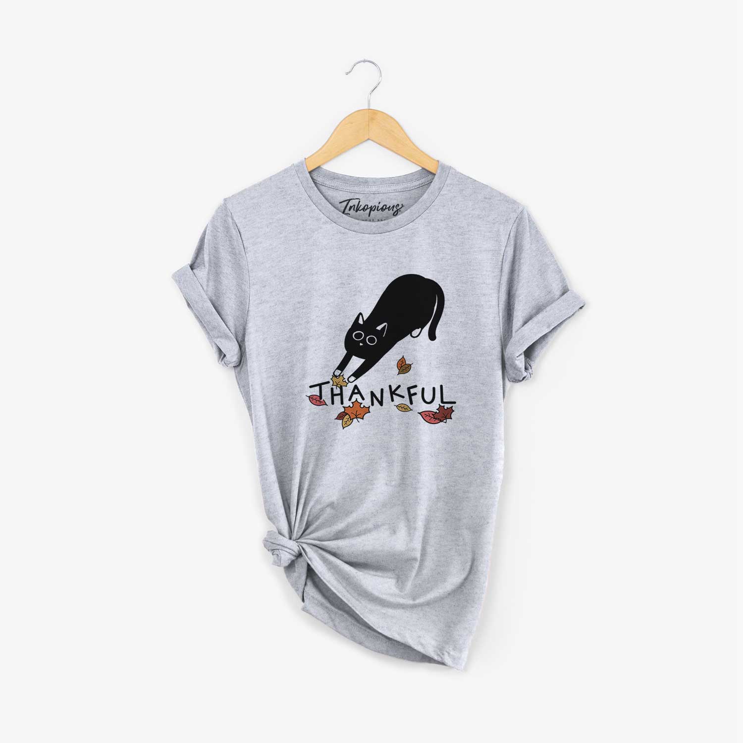 Minimalist line drawing of Bug the Black Cat with 'Thankful' lettering on a Grey Unisex crewneck