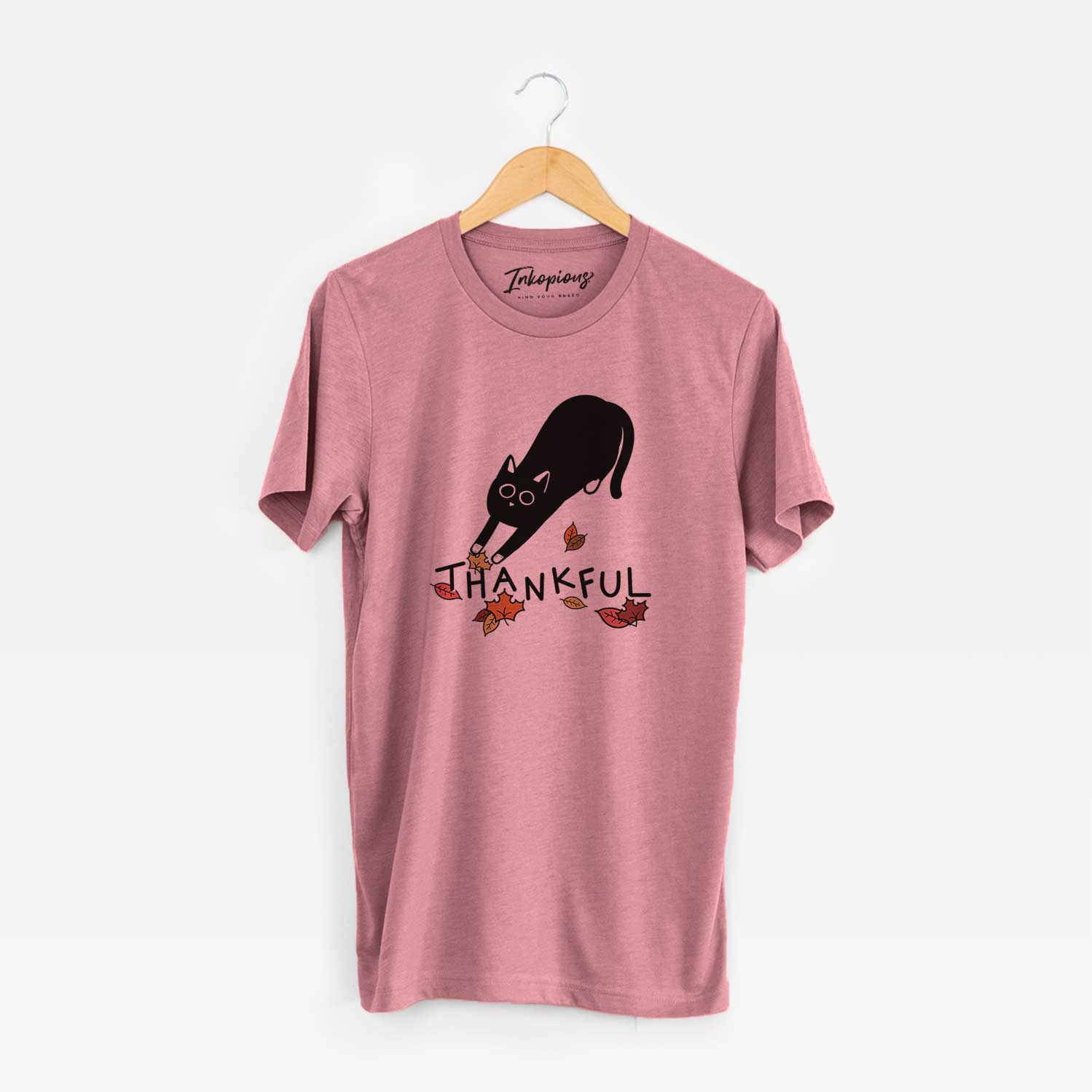 Minimalist line drawing of Bug the Black Cat with 'Thankful' lettering on a Mauve Unisex crewneck