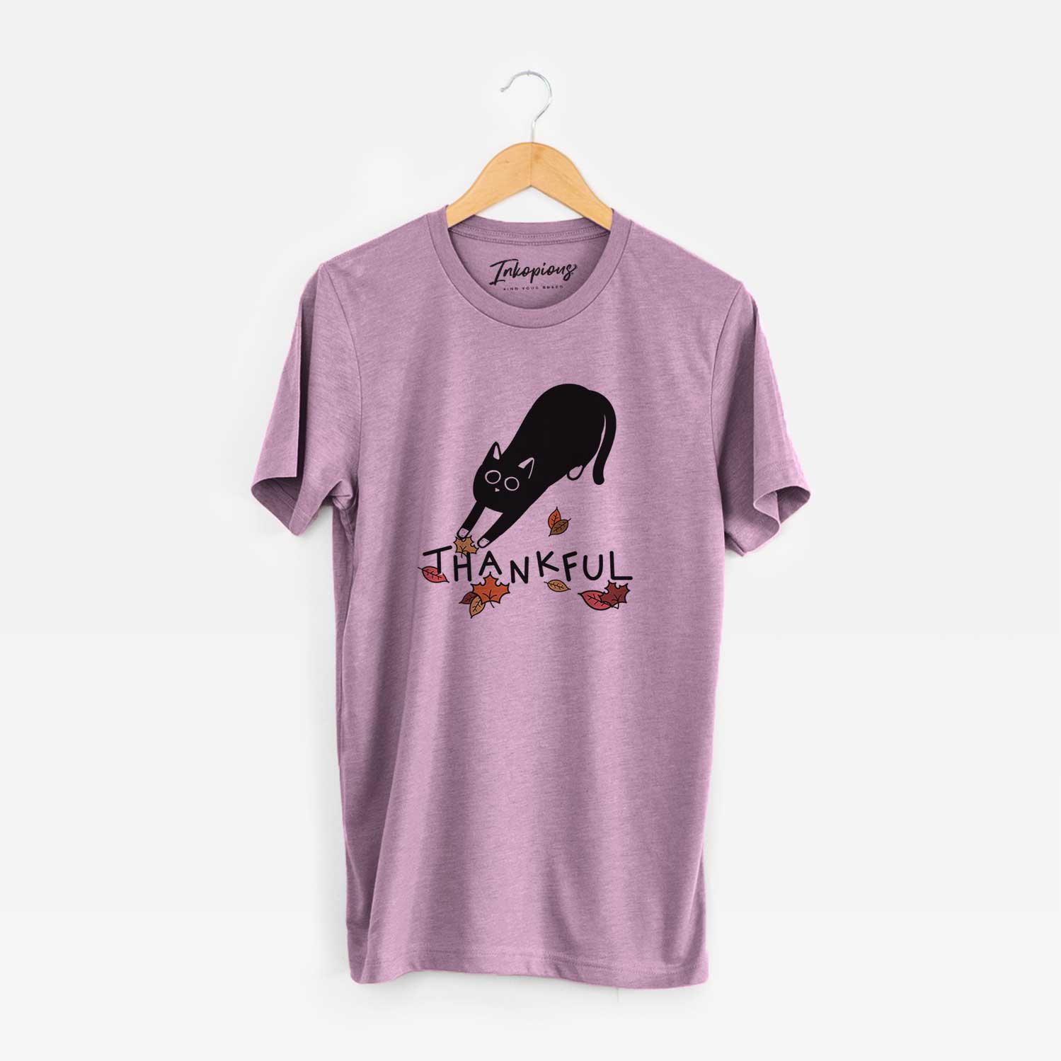 Minimalist line drawing of Bug the Black Cat with 'Thankful' lettering on an Orchid Unisex crewneck