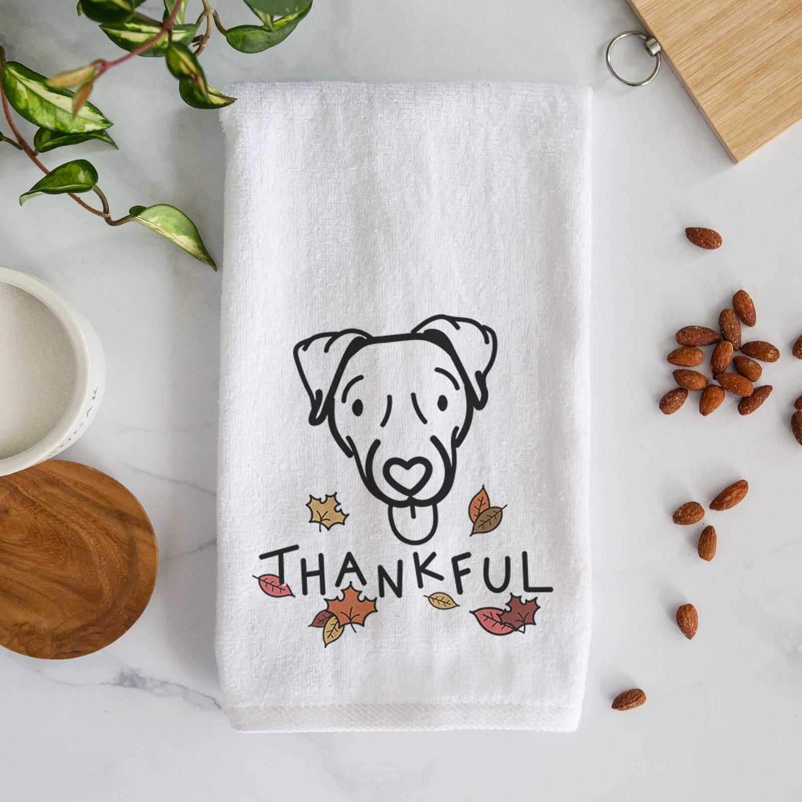 Minimalist line drawing of Cammy the Jack Russell Terrier with 'Thankful' lettering on a decorative hand towel