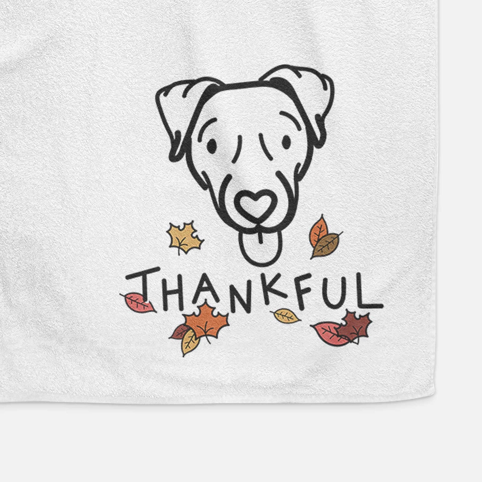 Minimalist line drawing of Cammy the Jack Russell Terrier with 'Thankful' lettering on a decorative hand towel