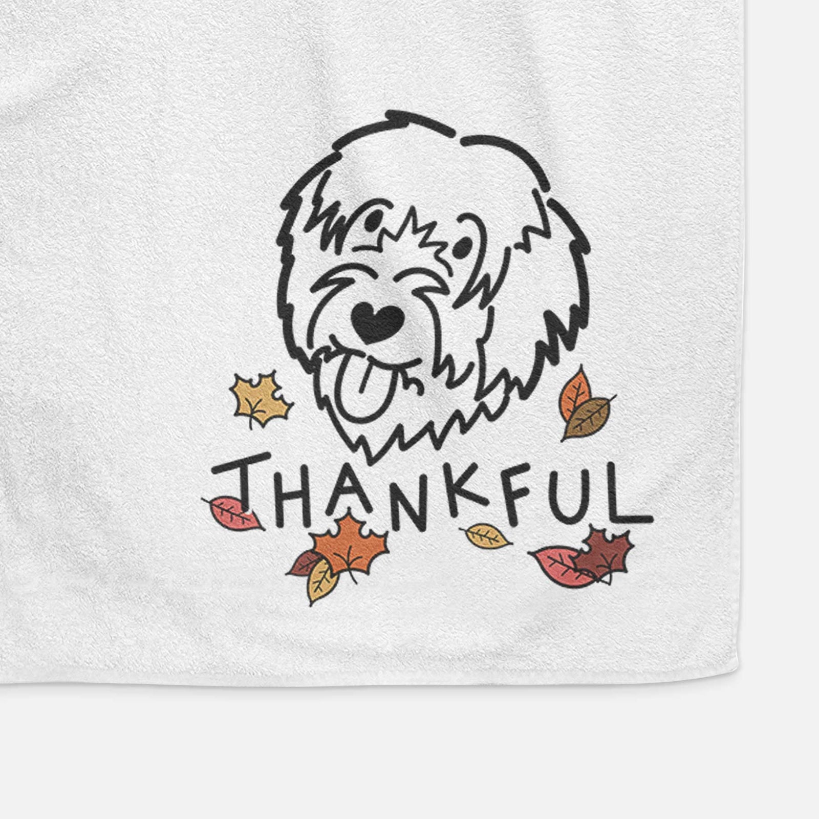 Minimalist line drawing of a Catalan Sheepdog with 'Thankful' lettering on a decorative hand towel