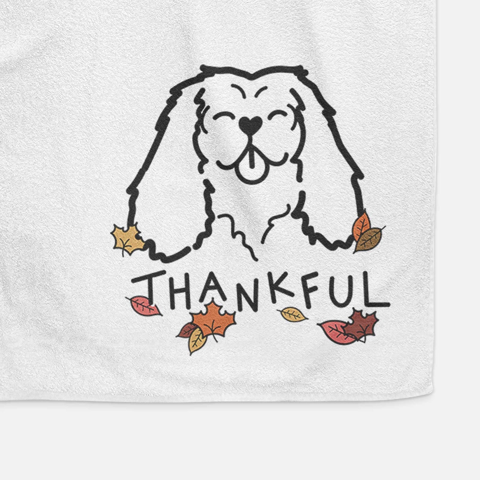 Minimalist line drawing of a Cavalier King Charles Spaniel with 'Thankful' lettering on a decorative hand towel