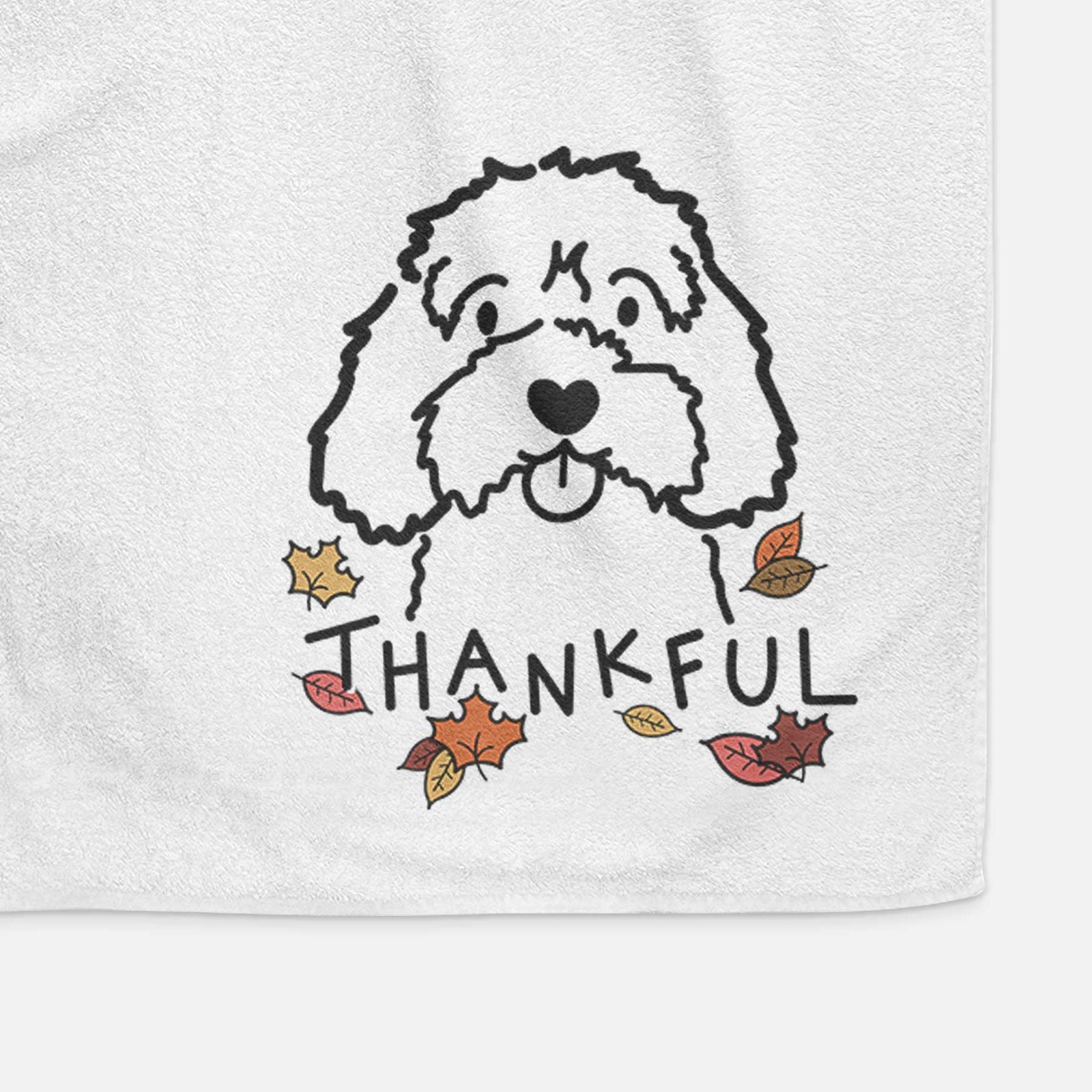 Minimalist line drawing of a Cavapoo with 'Thankful' lettering on a decorative hand towel