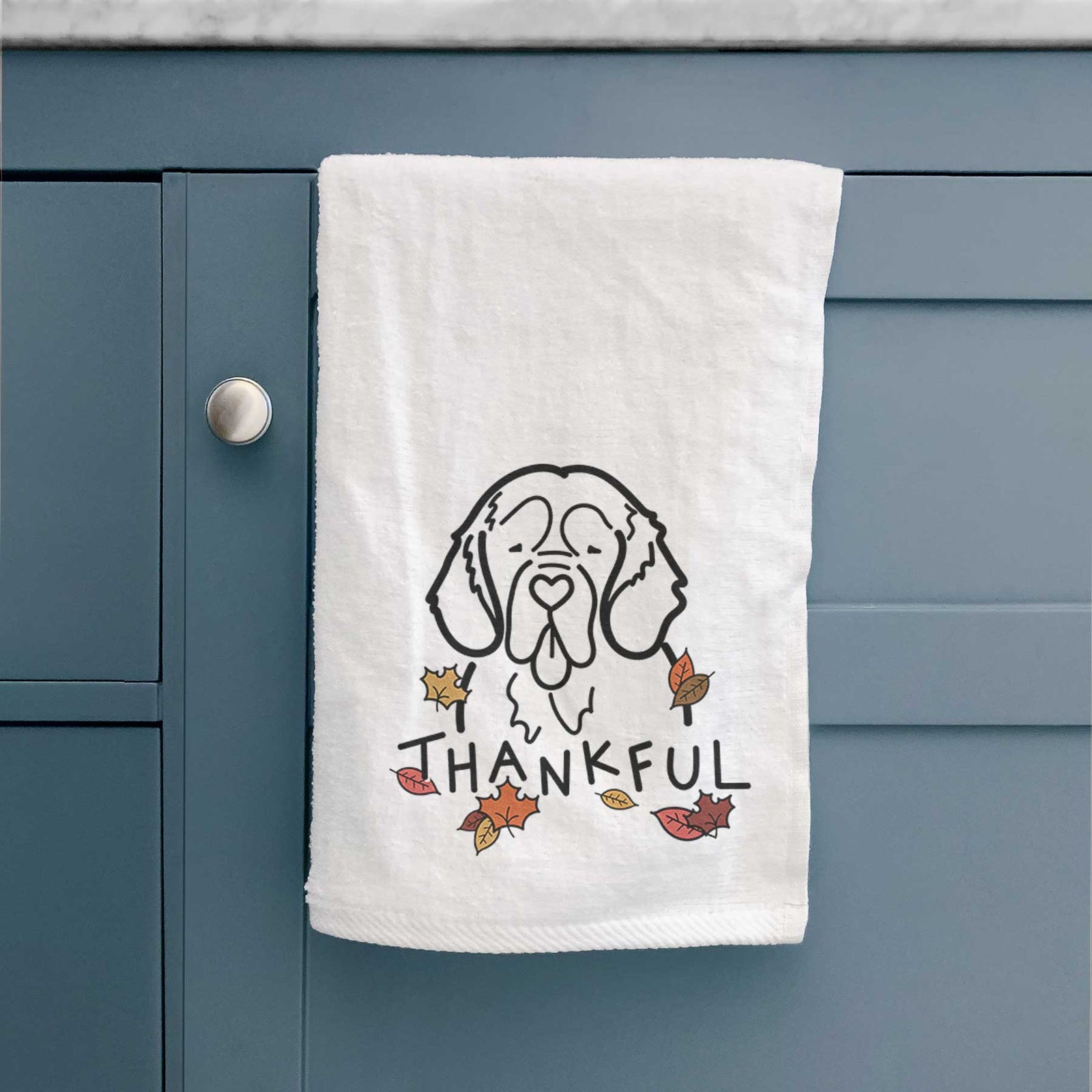 Minimalist line drawing of a Clumber Spaniel with 'Thankful' lettering on a decorative hand towel