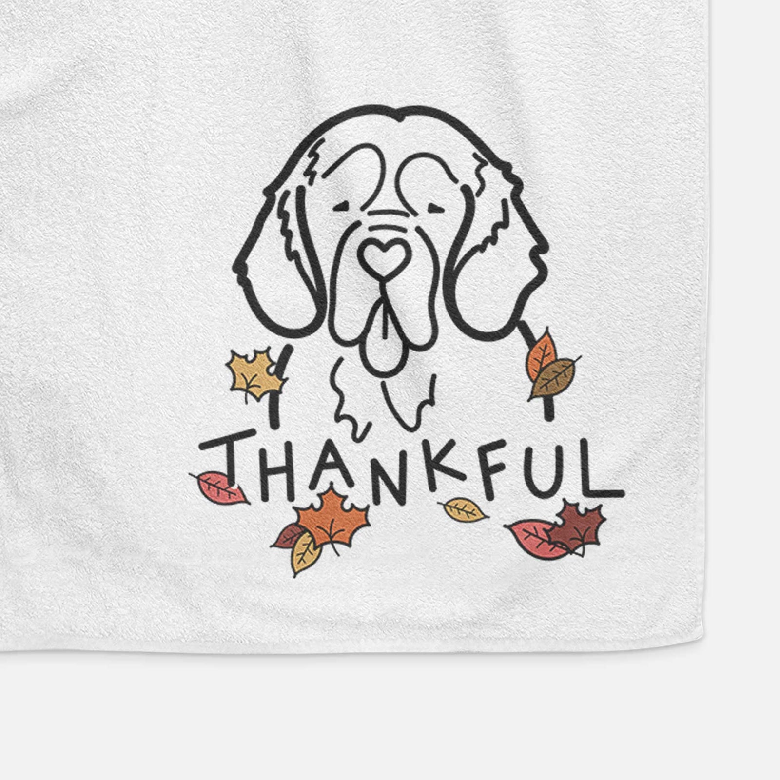 Minimalist line drawing of a Clumber Spaniel with 'Thankful' lettering on a decorative hand towel