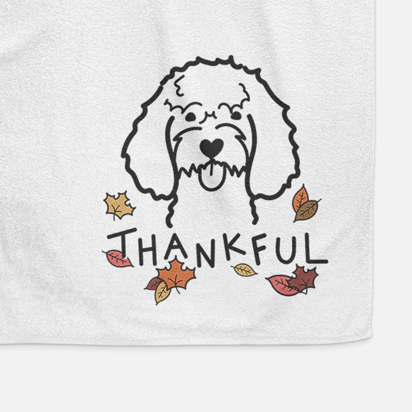 Minimalist line drawing of a Cockapoo with 'Thankful' lettering on a decorative hand towel