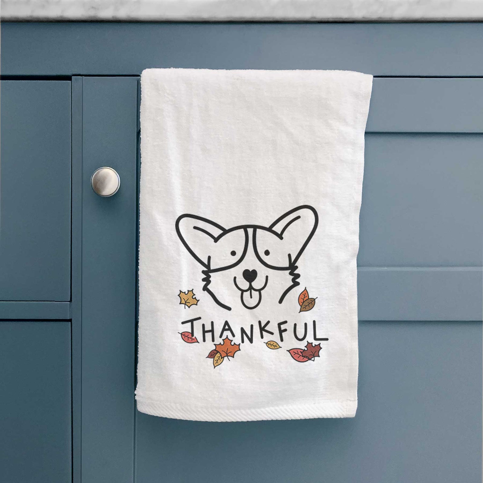 Minimalist line drawing of a Corgi with 'Thankful' lettering on a decorative hand towel