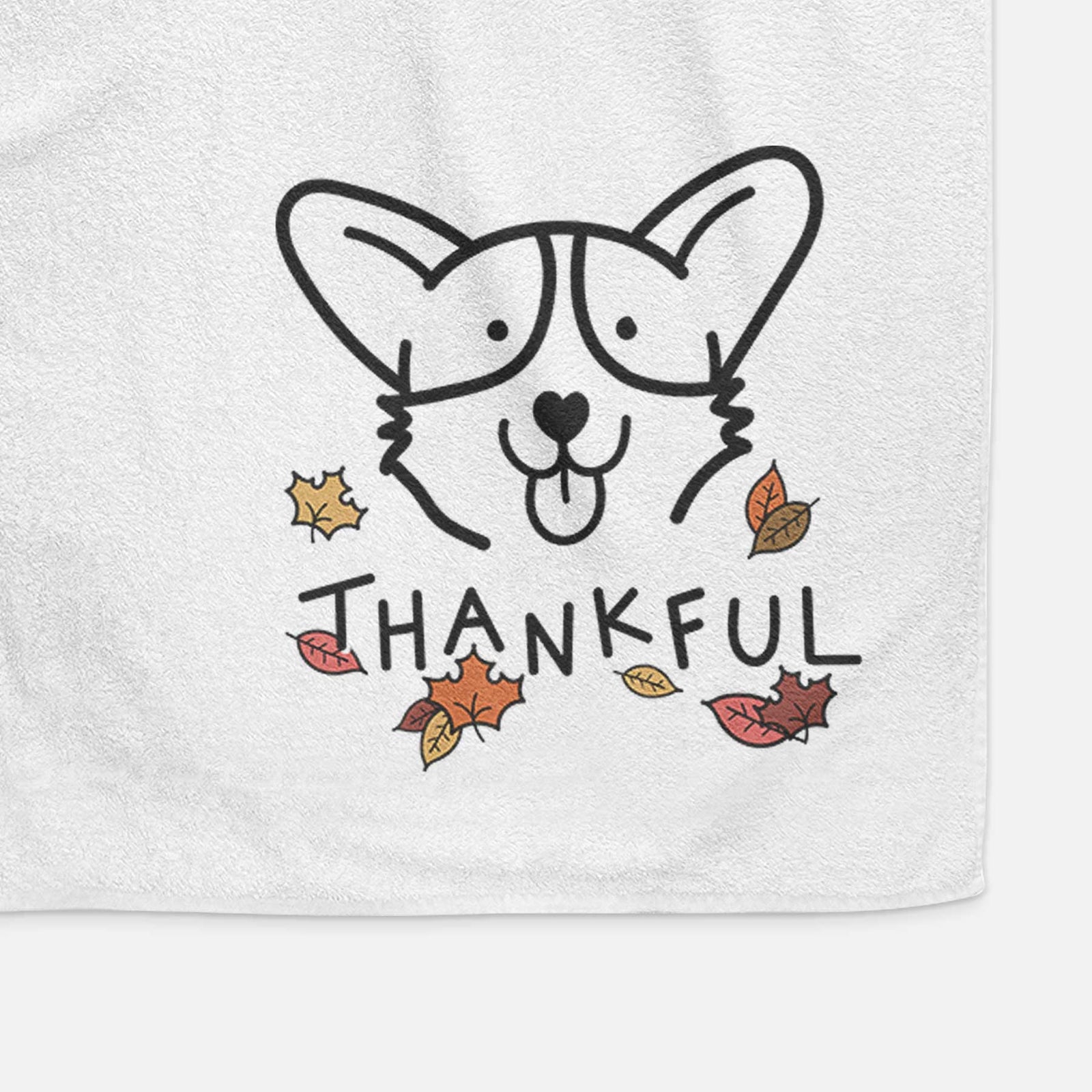 Minimalist line drawing of a Corgi with 'Thankful' lettering on a decorative hand towel