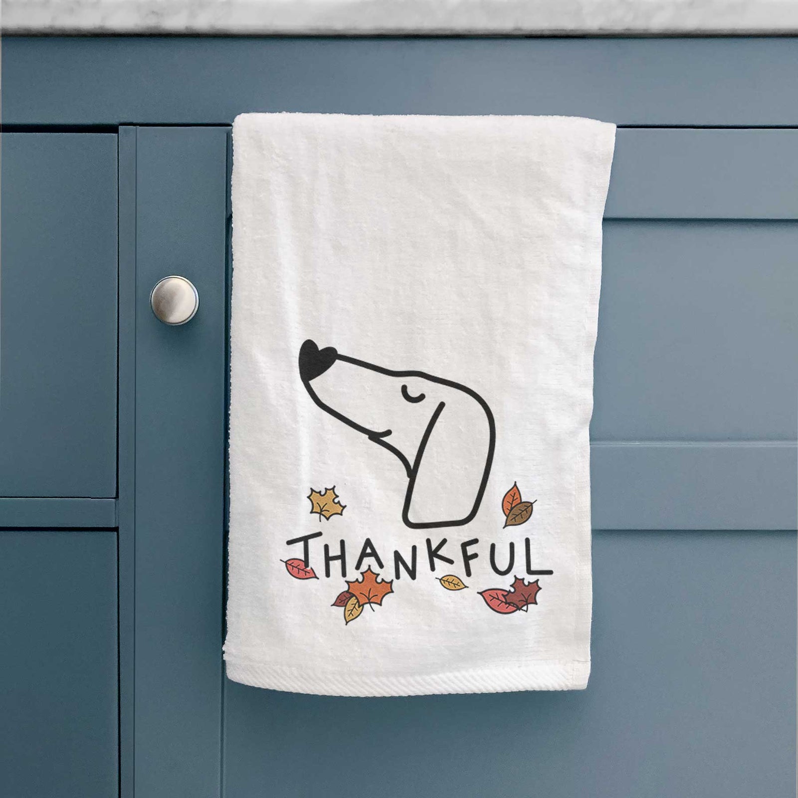 Minimalist line drawing of a Dachshund with 'Thankful' lettering on a decorative hand towel