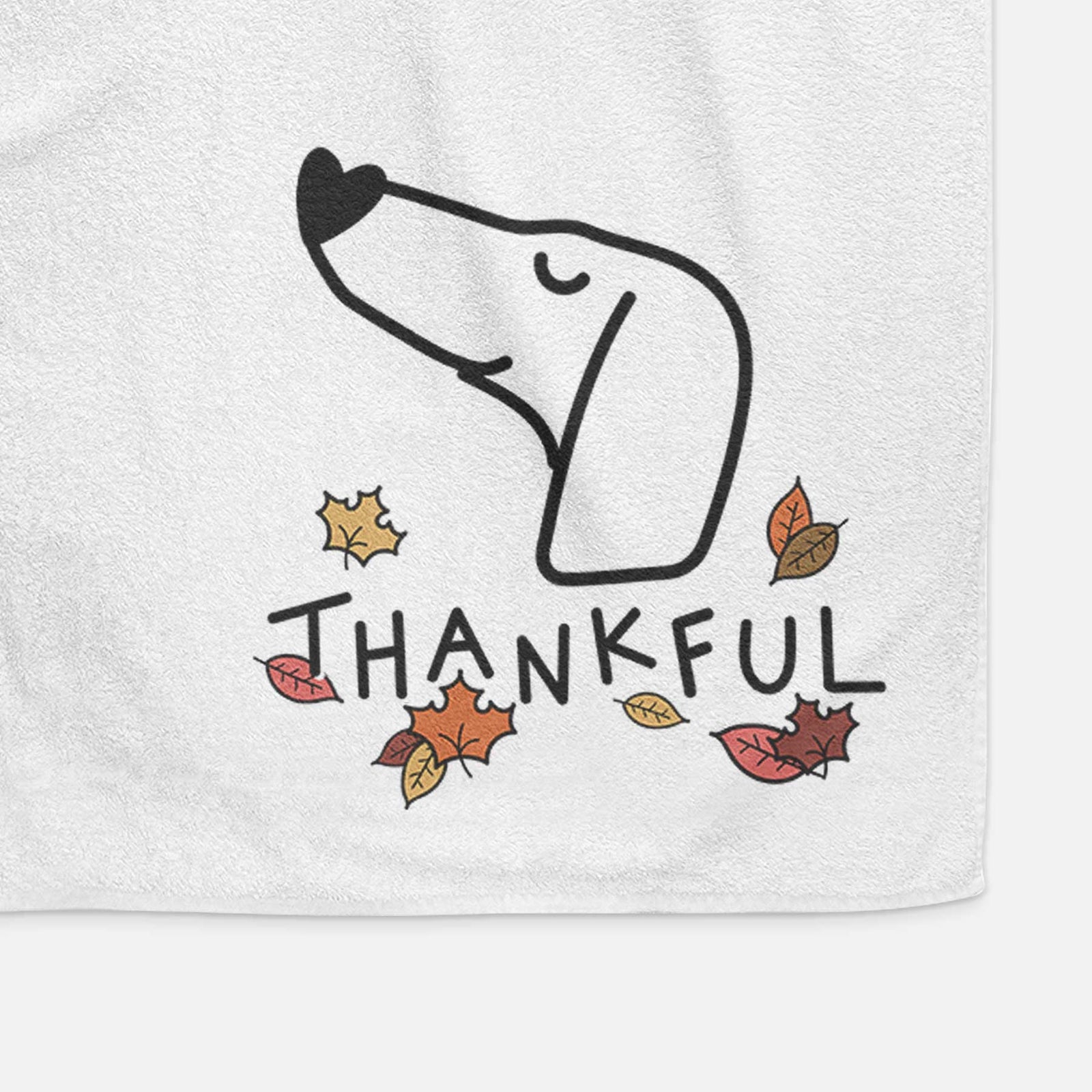 Minimalist line drawing of a Dachshund with 'Thankful' lettering on a decorative hand towel