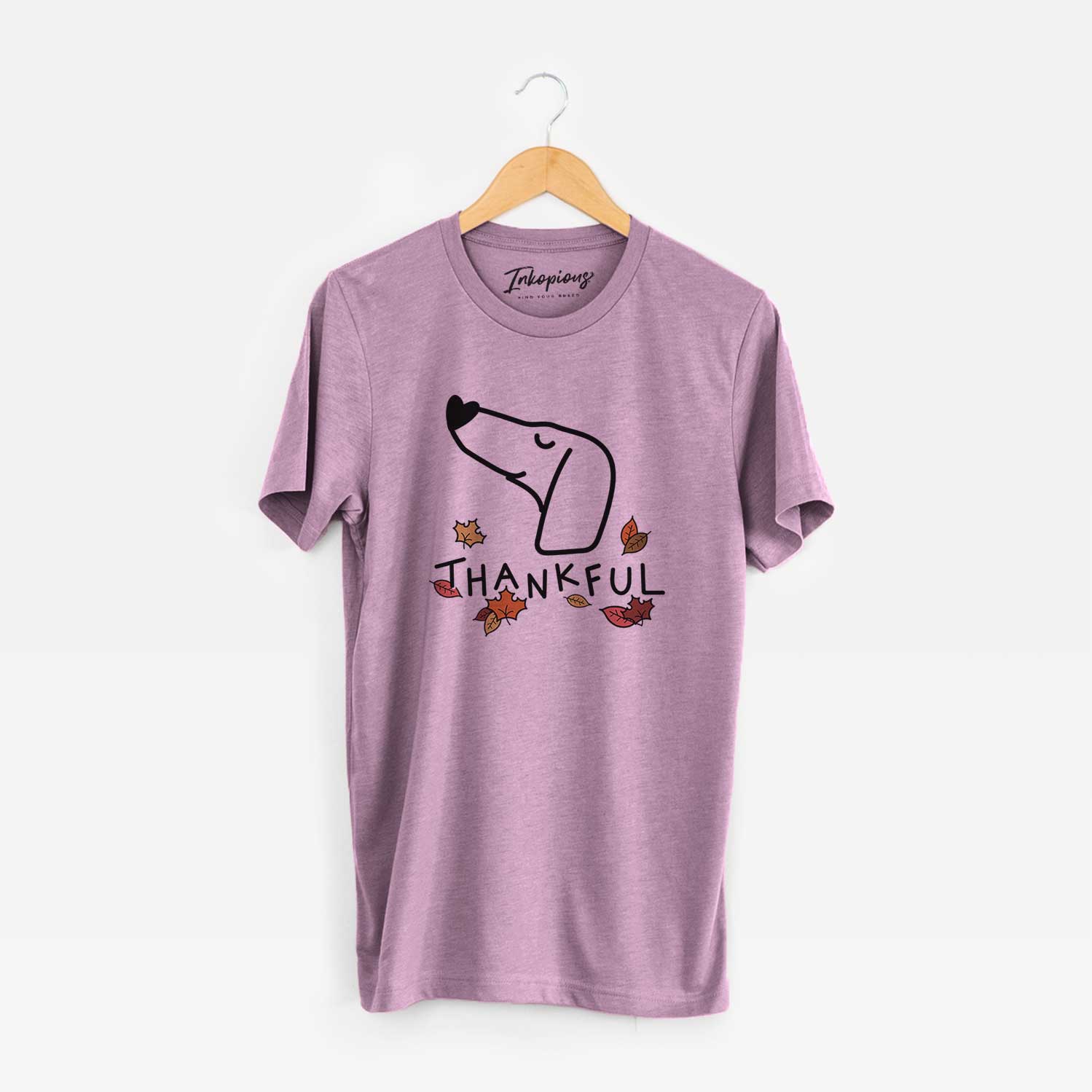Minimalist line drawing of a Dachshund with 'Thankful' lettering on an Orchid Unisex crewneck
