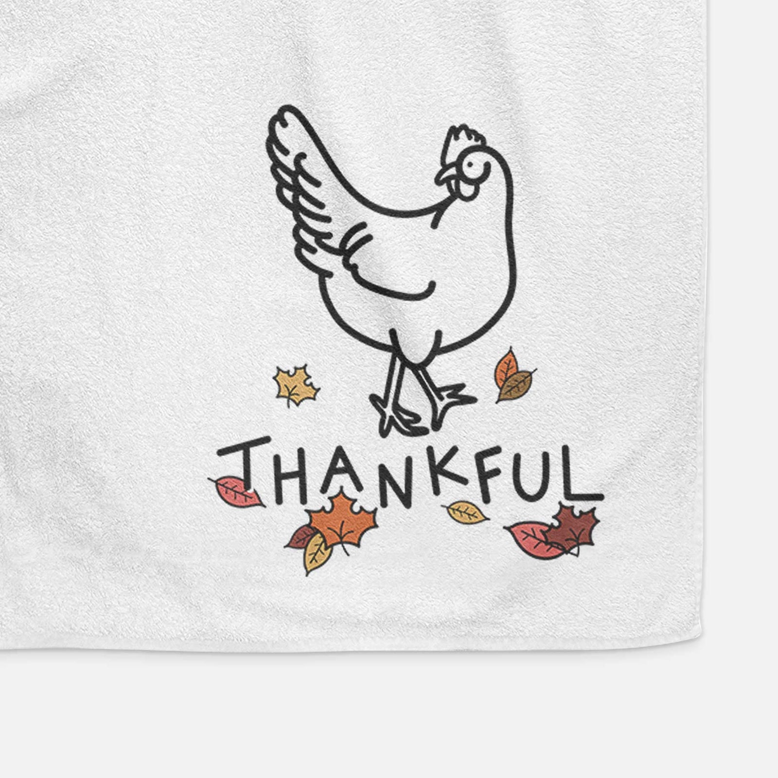 Minimalist line drawing of Daisy the Chicken with 'Thankful' lettering on a decorative hand towel