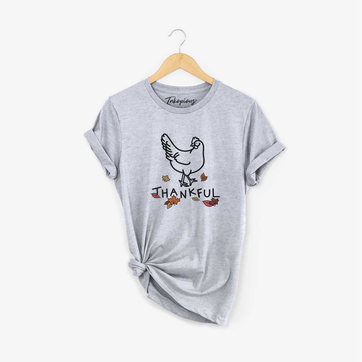 Minimalist line drawing of Daisy the Chicken with 'Thankful' lettering on a Grey Unisex crewneck
