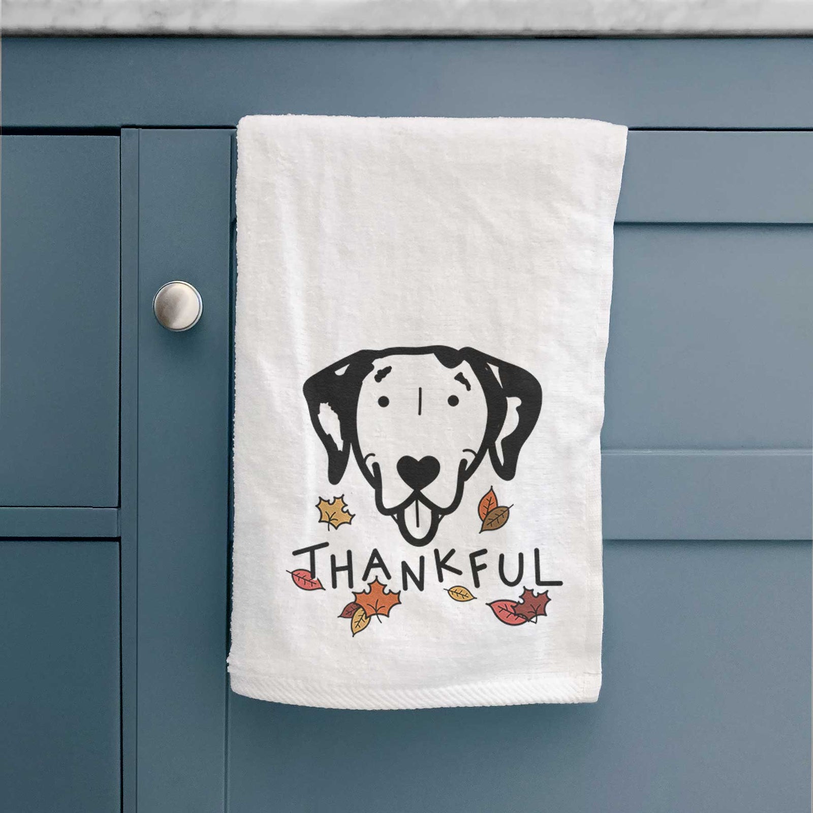 Minimalist line drawing of a Dalmatian with 'Thankful' lettering on a decorative hand towel