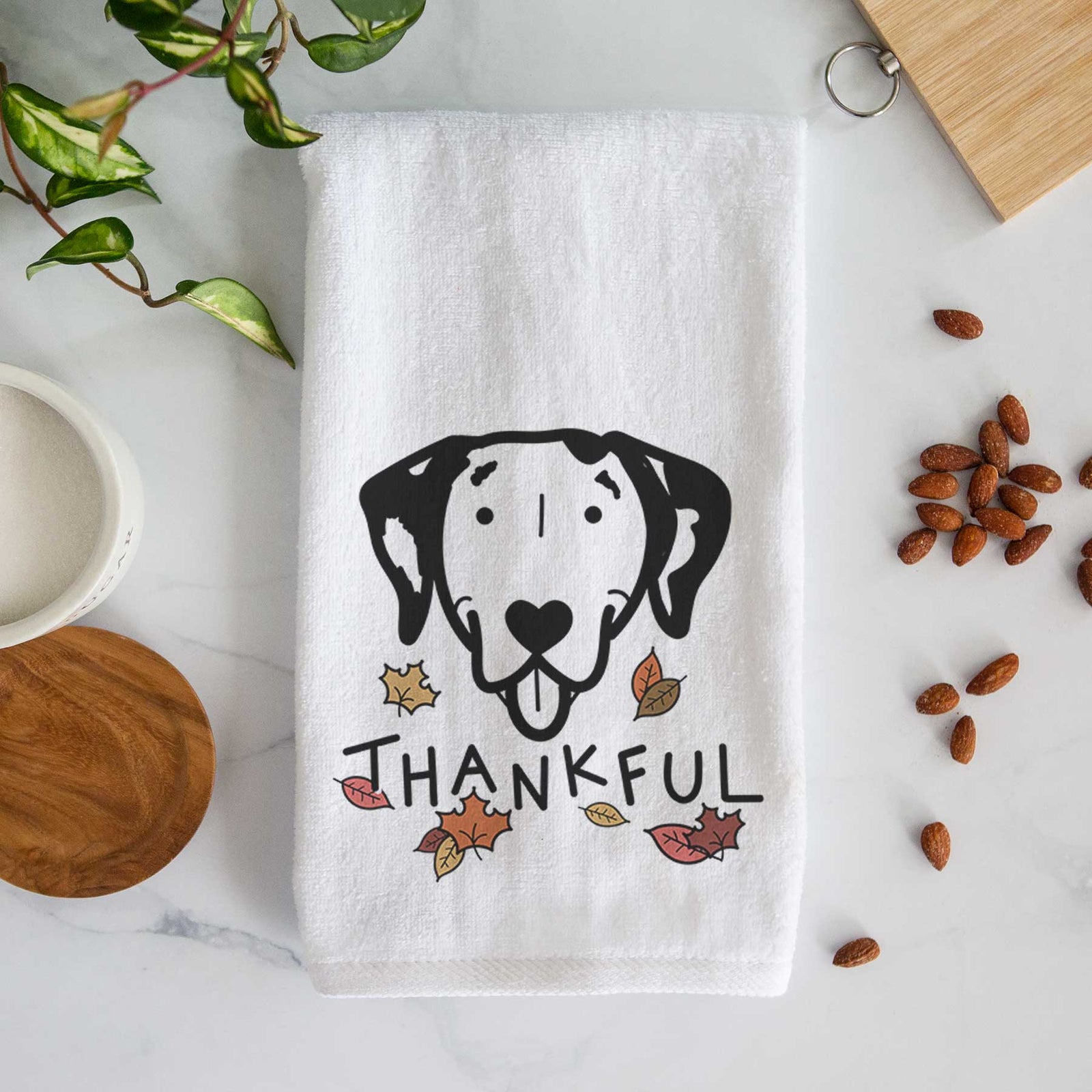 Minimalist line drawing of a Dalmatian with 'Thankful' lettering on a decorative hand towel