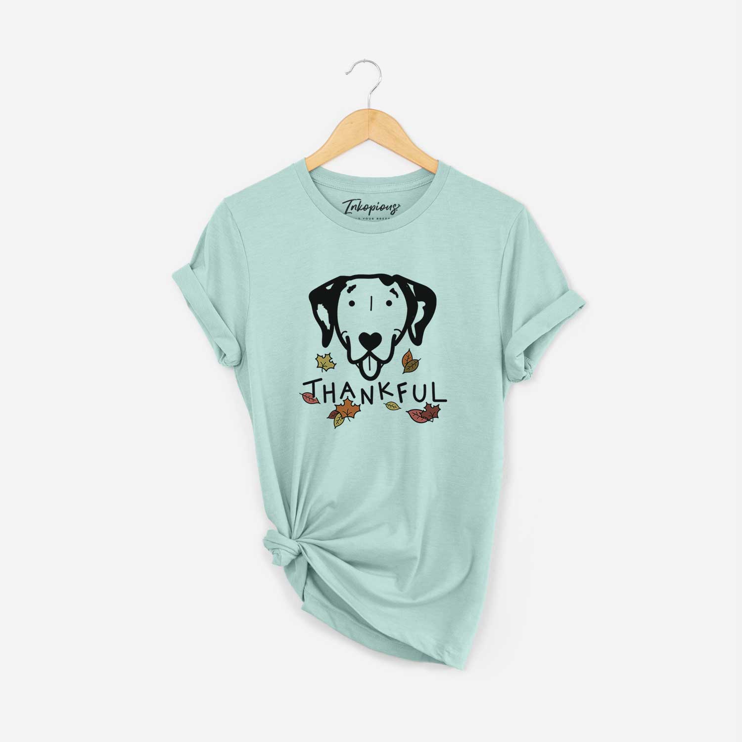 Minimalist line drawing of a Dalmatian with 'Thankful' lettering on a Heather Sage Unisex crewneck