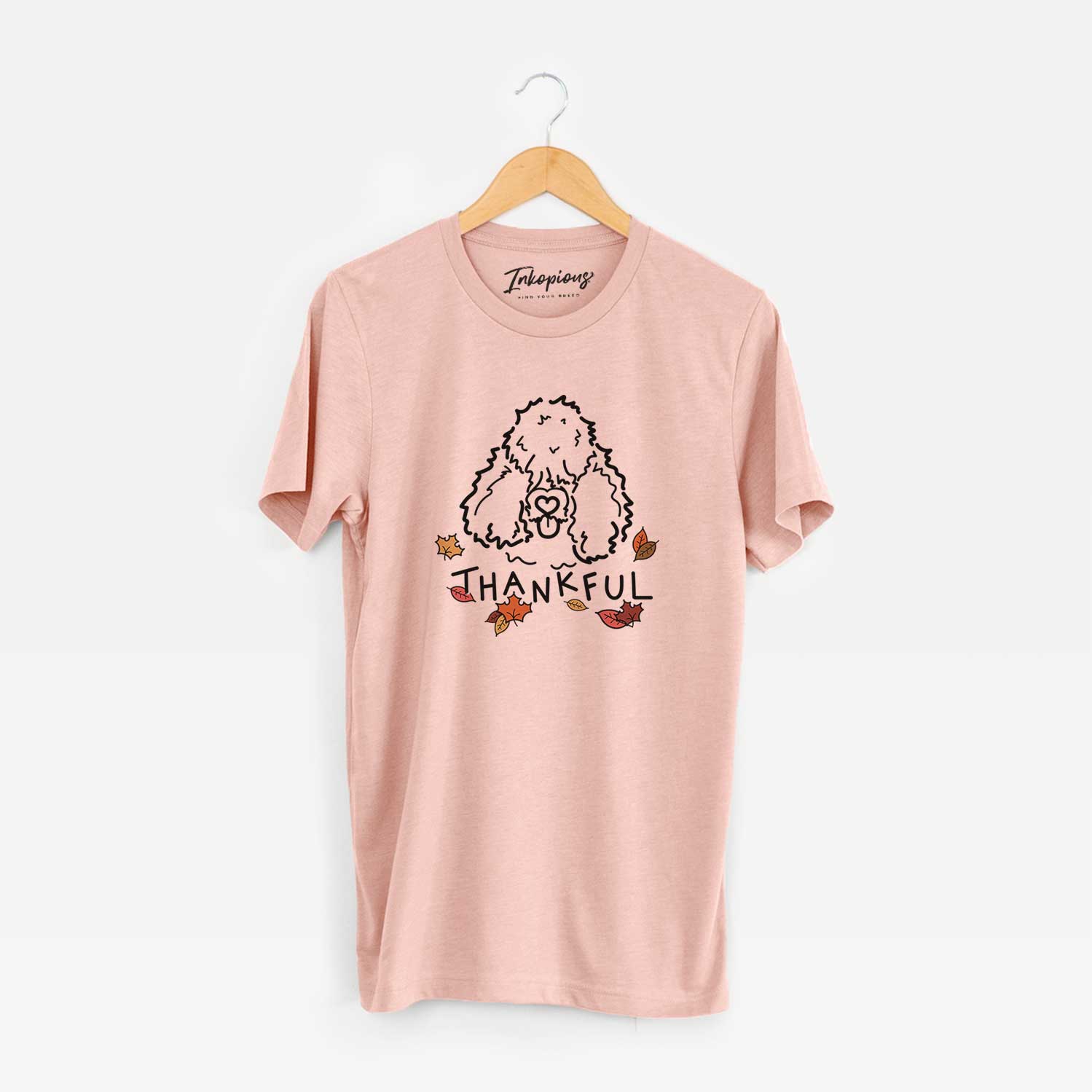 Minimalist line drawing of Deeogey the Bouvier des Flandres with 'Thankful' lettering on a Peach Unisex crewneck