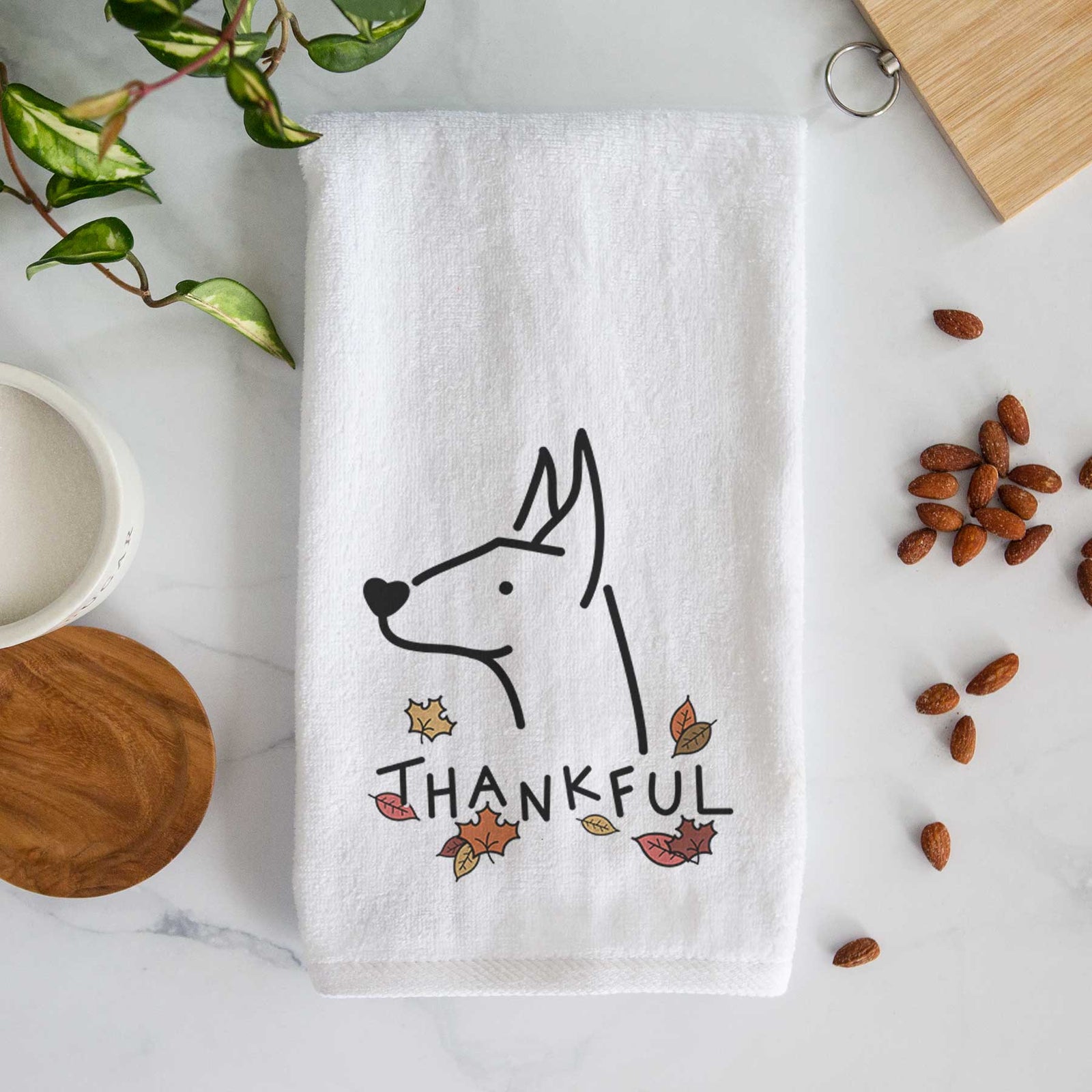 Minimalist line drawing of a Doberman Pinscher with 'Thankful' lettering on a decorative hand towel