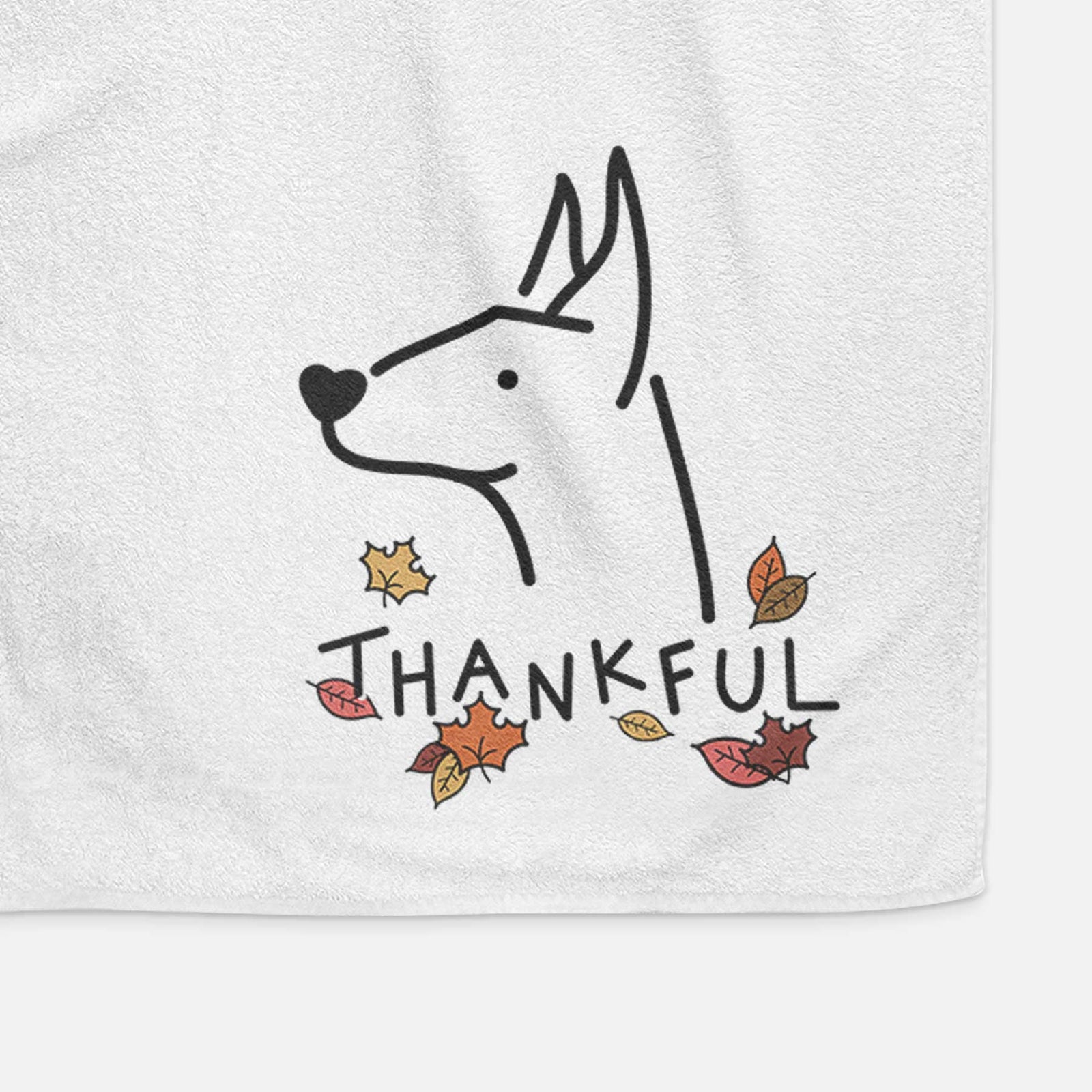 Minimalist line drawing of a Doberman Pinscher with 'Thankful' lettering on a decorative hand towel