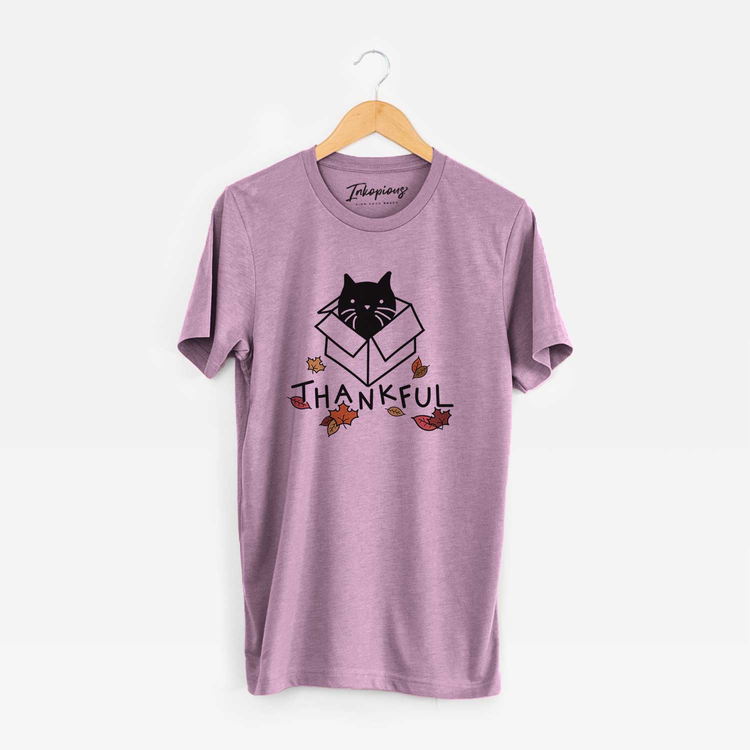 Minimalist line drawing of Doc the Black Cat in a Box with 'Thankful' lettering on an Orchid Unisex crewneck