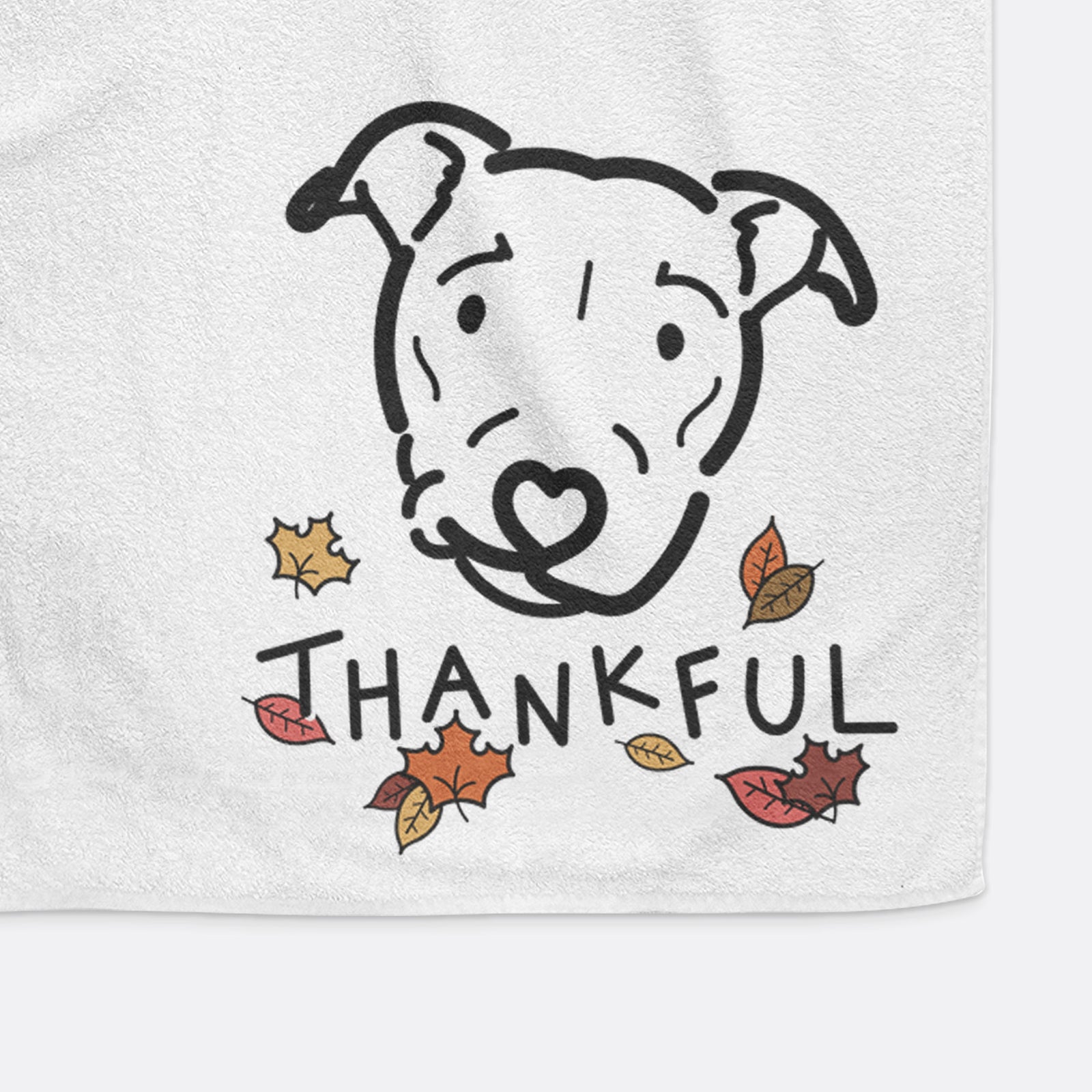 Minimalist line drawing of Ernie the Pitbull Mix with 'Thankful' lettering on a decorative hand towel