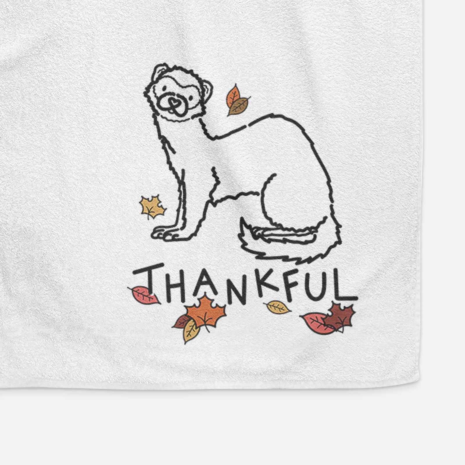 Minimalist line drawing of Fern the Ferret with 'Thankful' lettering on a decorative hand towel
