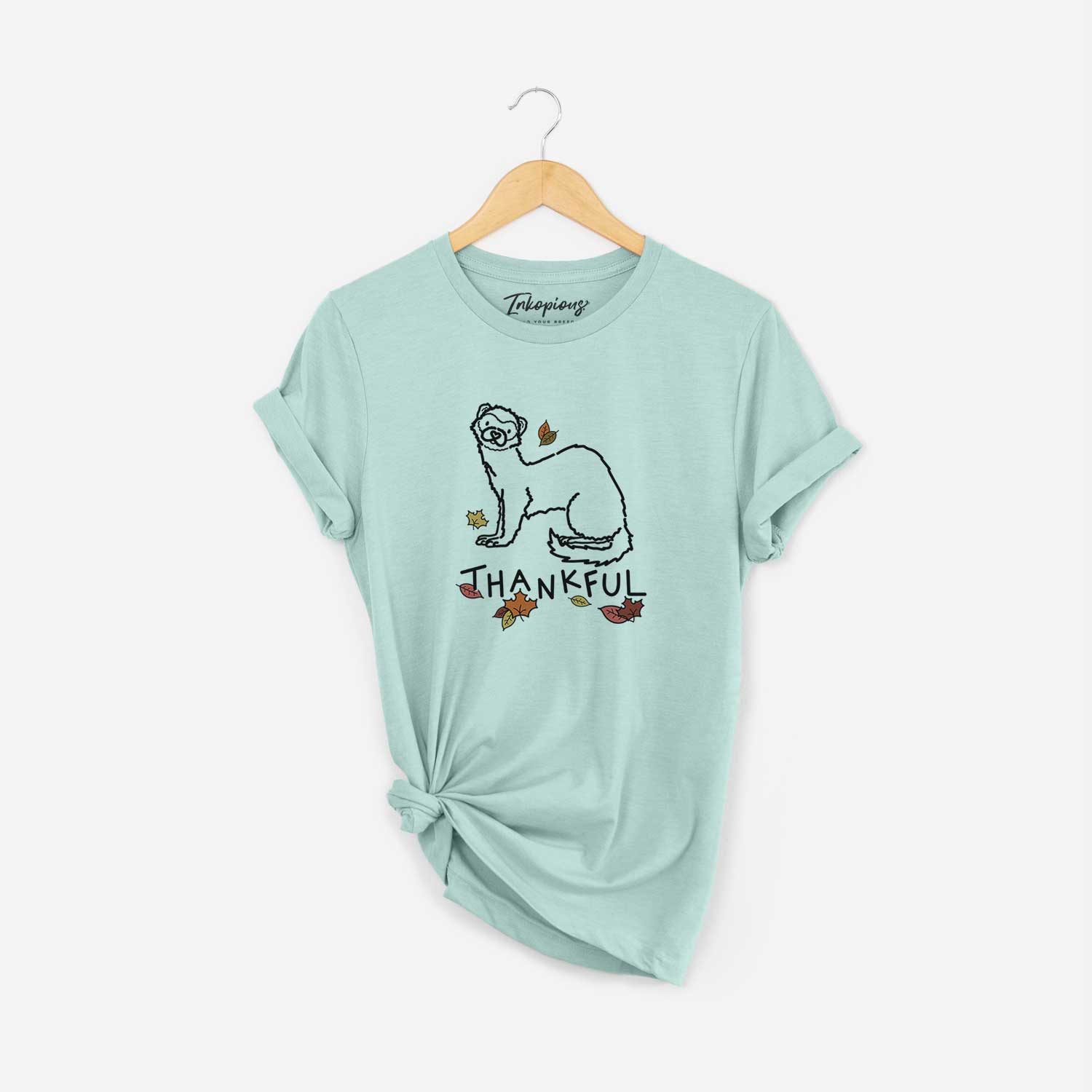 Minimalist line drawing of Fern the Ferret with 'Thankful' lettering on a Heather Sage Unisex crewneck