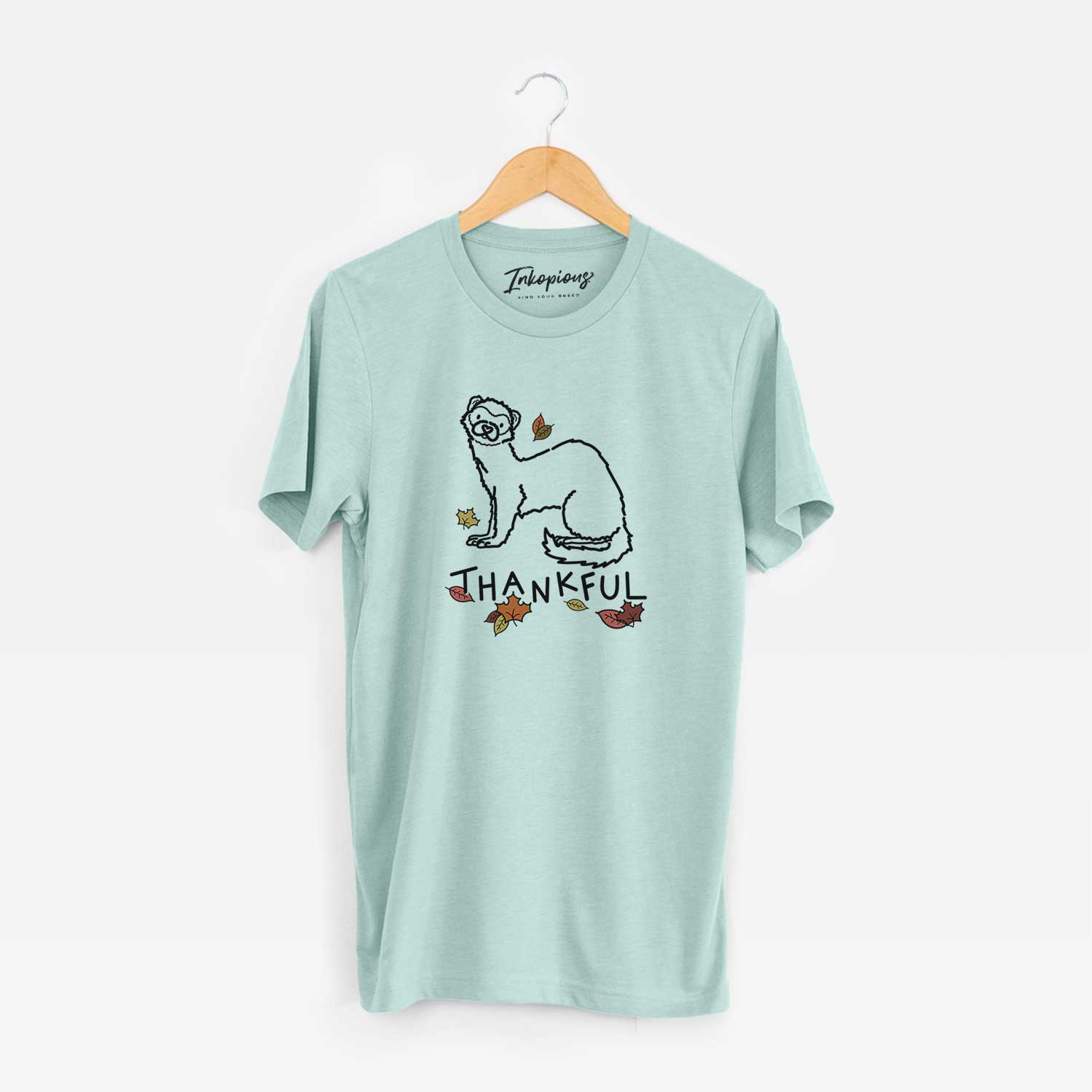 Minimalist line drawing of Fern the Ferret with 'Thankful' lettering on a Heather Sage Unisex crewneck