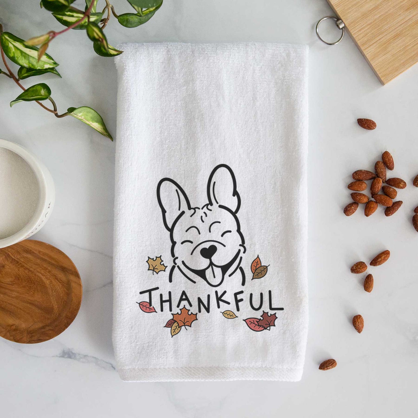 Minimalist line drawing of a French Bulldog with 'Thankful' lettering on a decorative hand towel