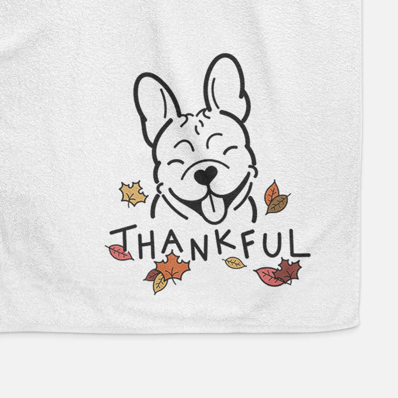 Minimalist line drawing of a French Bulldog with 'Thankful' lettering on a decorative hand towel