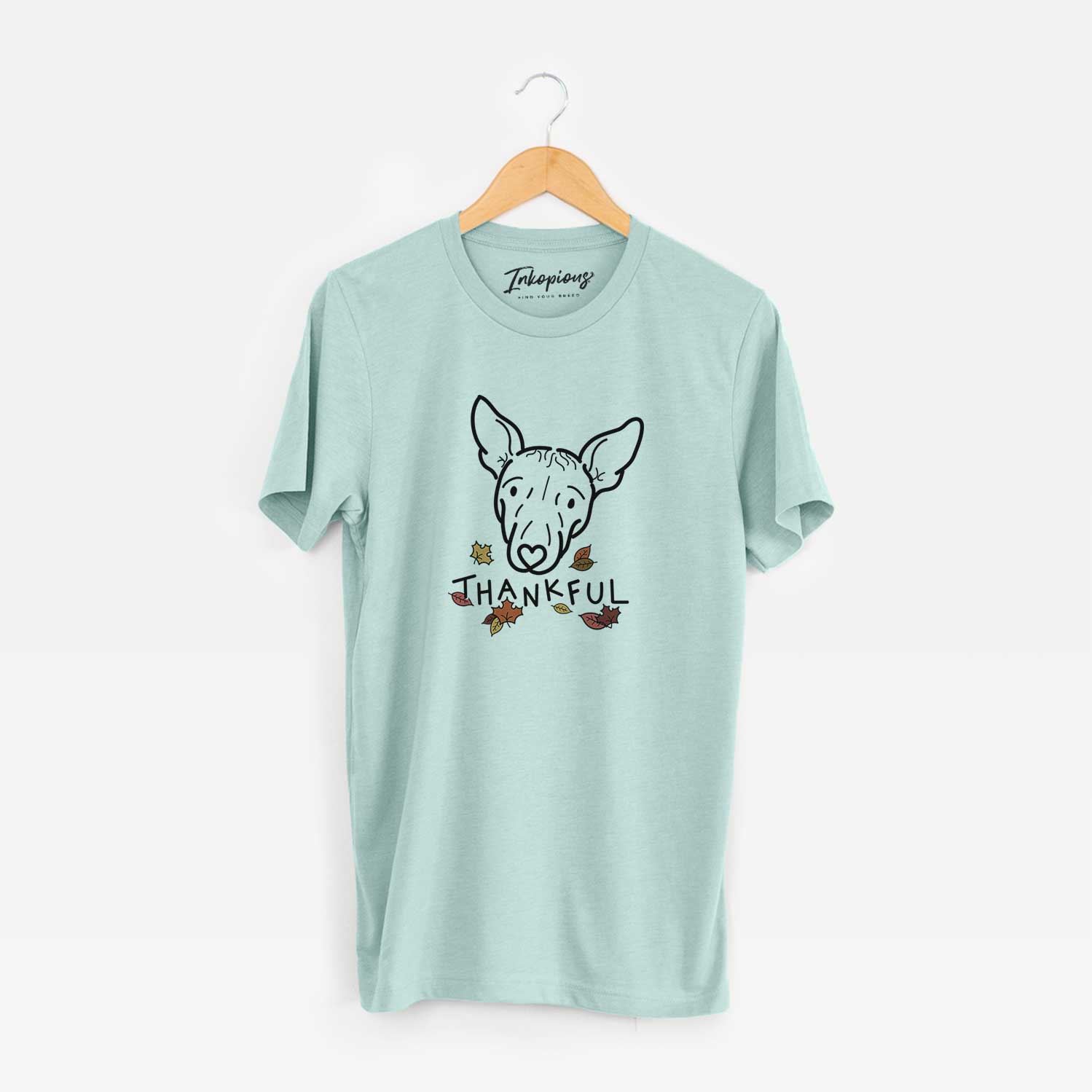 Minimalist line drawing of Georgia the American Hairless Terrier with 'Thankful' lettering on a Heather Sage Unisex crewneck