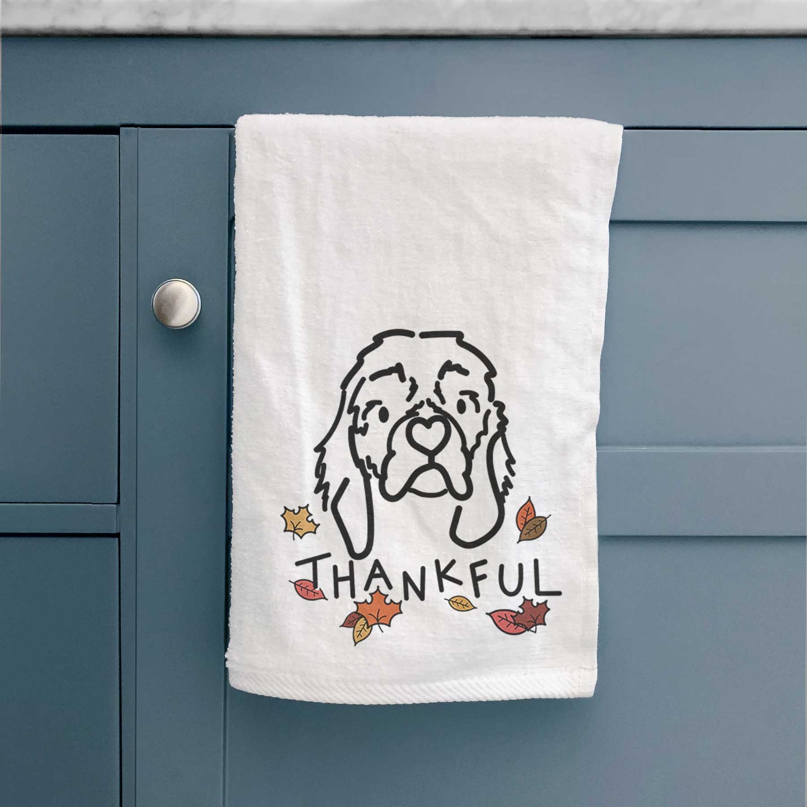 Minimalist line drawing of GiGi the Cocker Spaniel with 'Thankful' lettering on a decorative hand towel