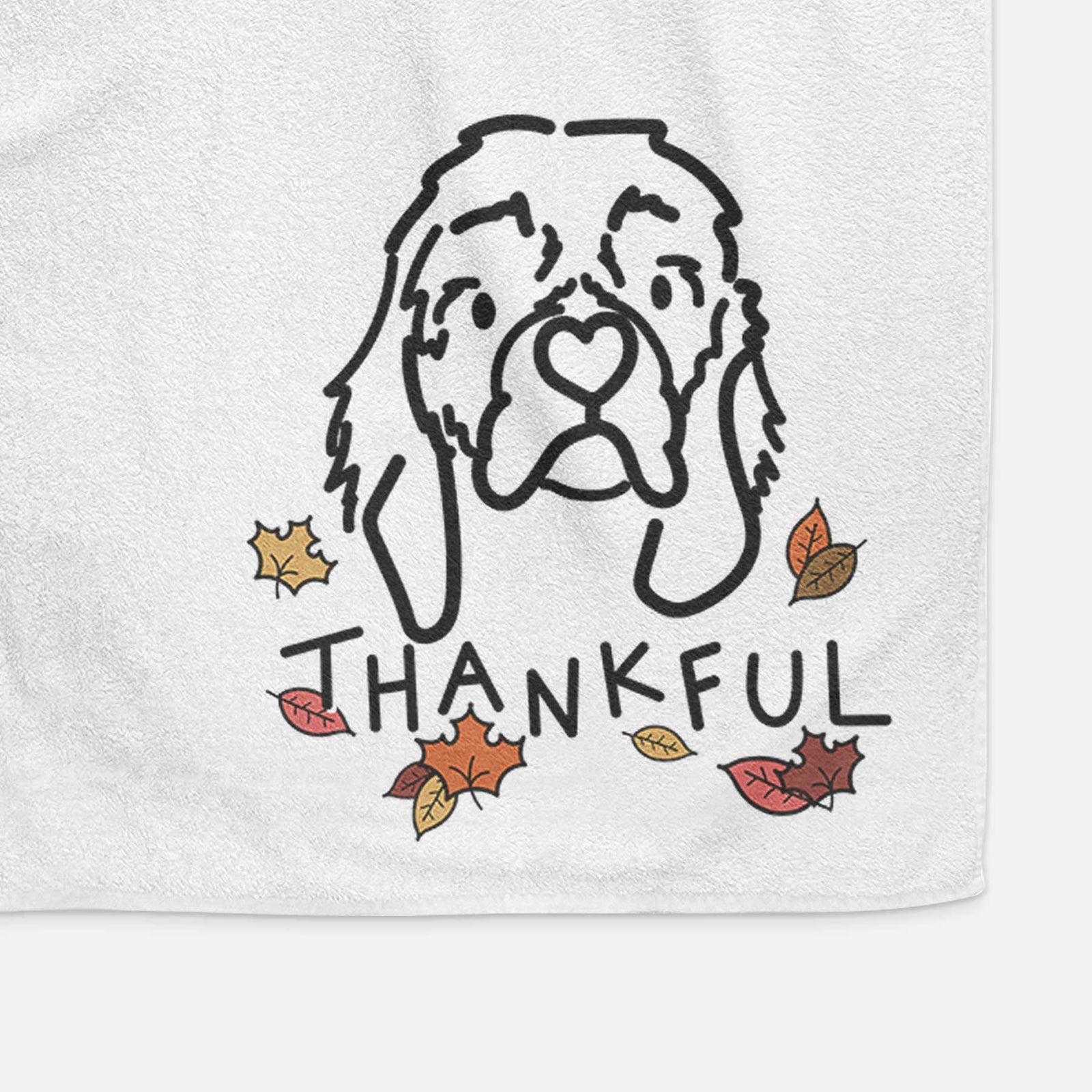 Minimalist line drawing of GiGi the Cocker Spaniel with 'Thankful' lettering on a decorative hand towel