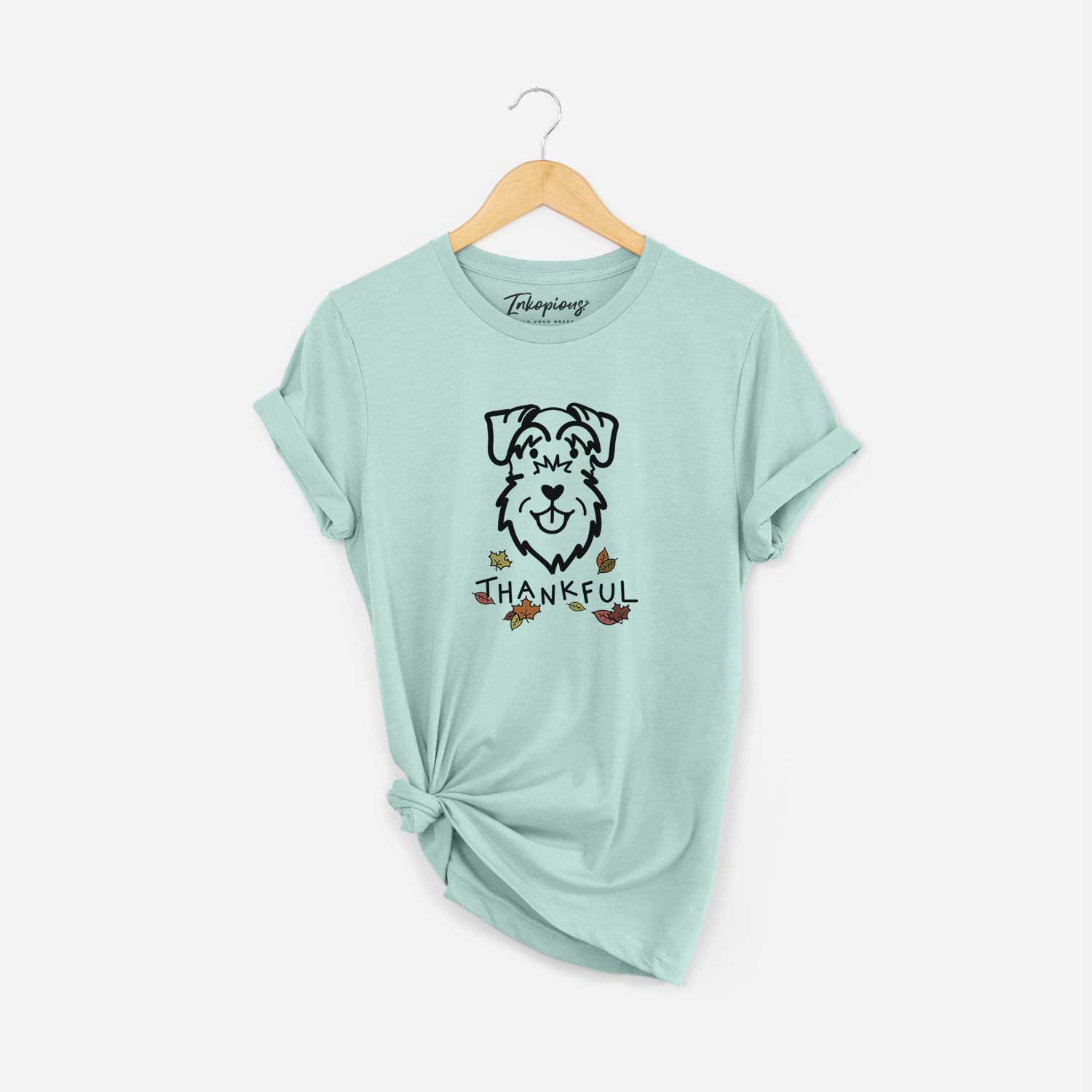Minimalist line drawing of a Schnauzer Natural Ears with 'Thankful' lettering on a Heather Sage Unisex crewneck