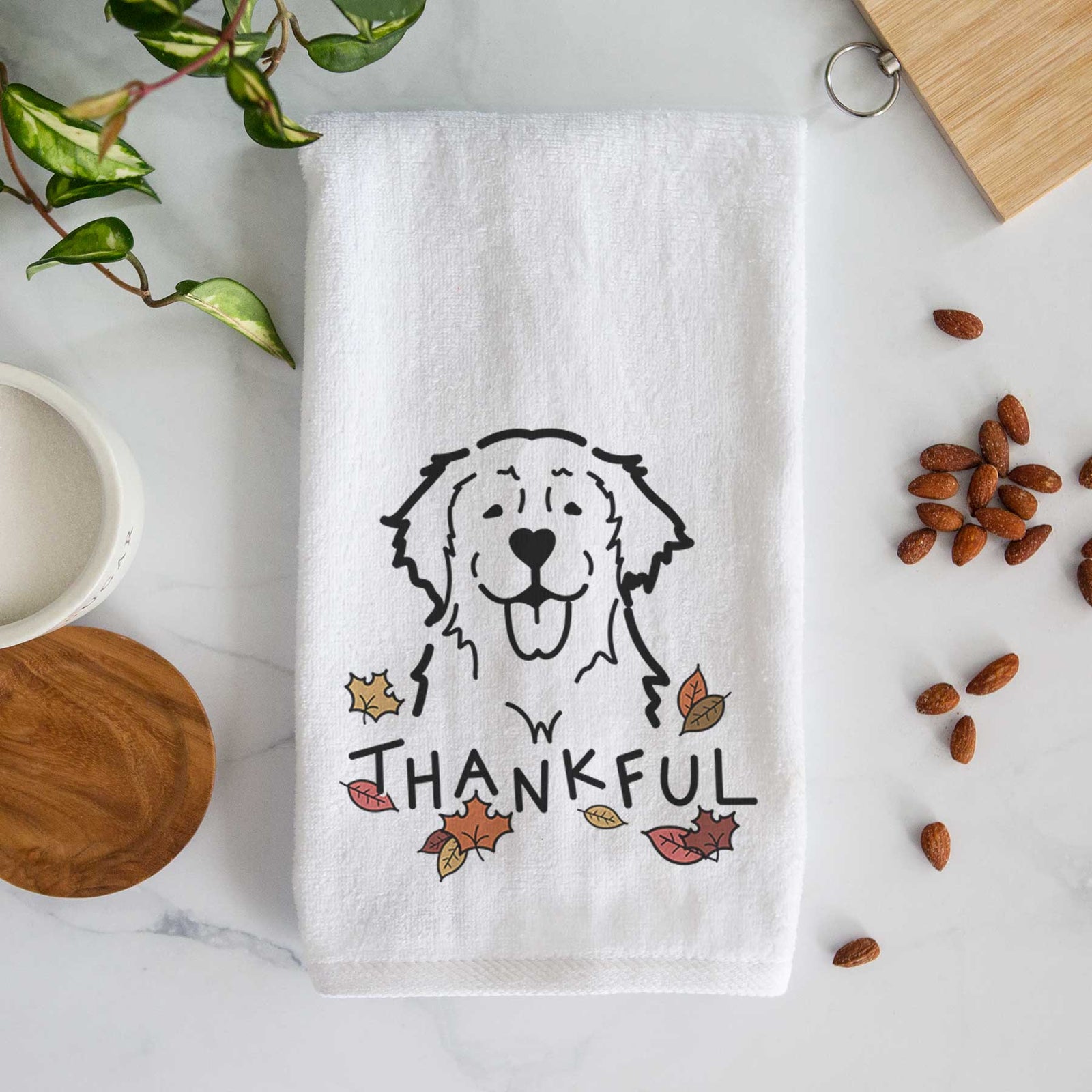 Minimalist line drawing of a Golden Retriever with 'Thankful' lettering on a decorative hand towel