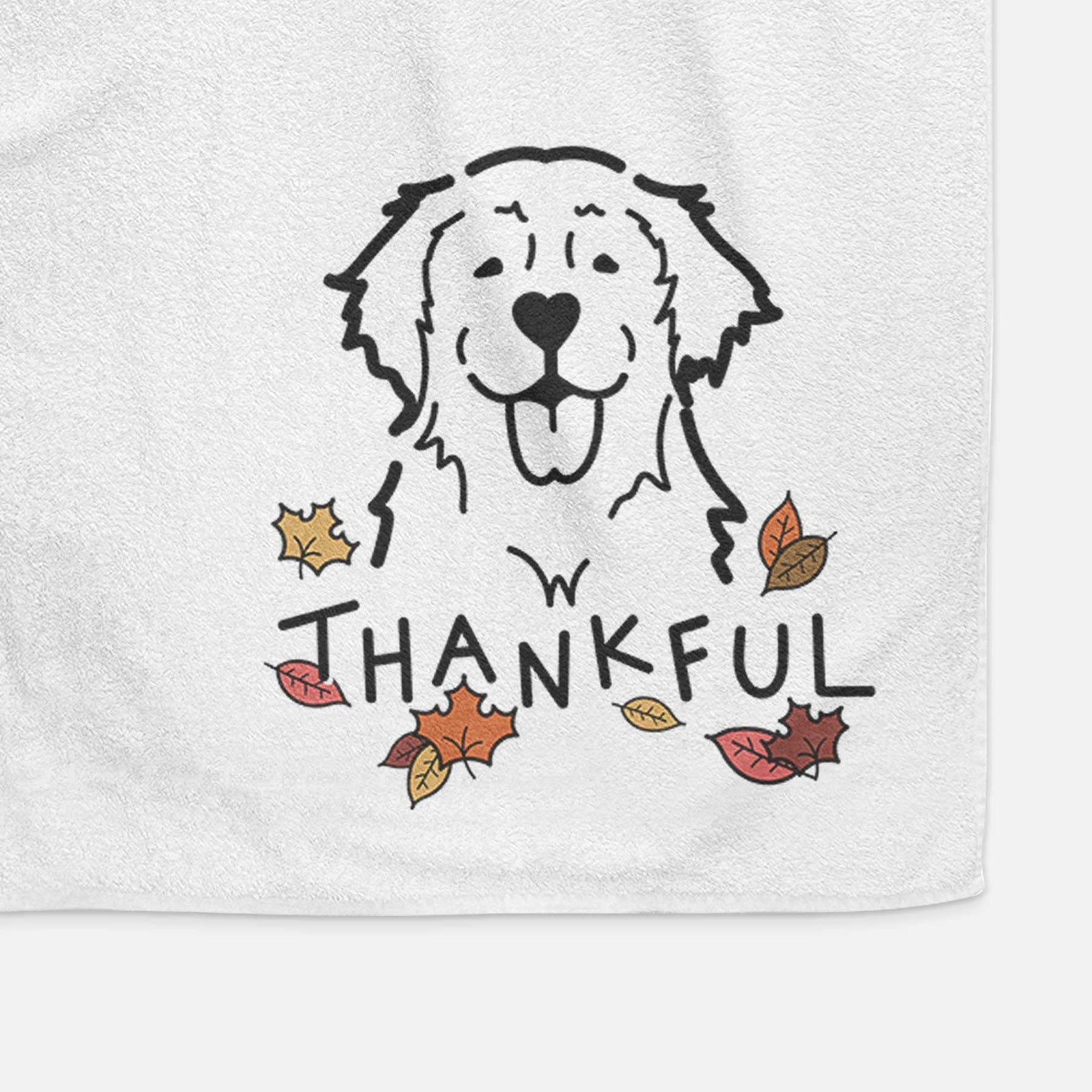 Minimalist line drawing of a Golden Retriever with 'Thankful' lettering on a decorative hand towel