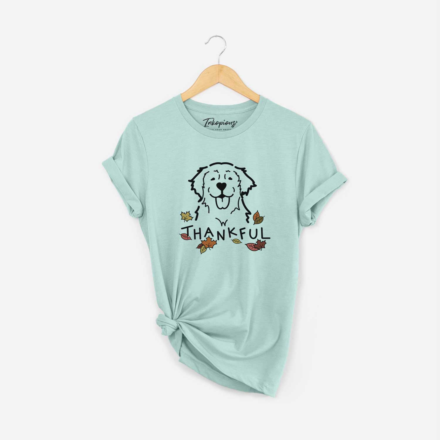 Minimalist line drawing of a Golden Retriever with 'Thankful' lettering on a Heather Sage Unisex crewneck