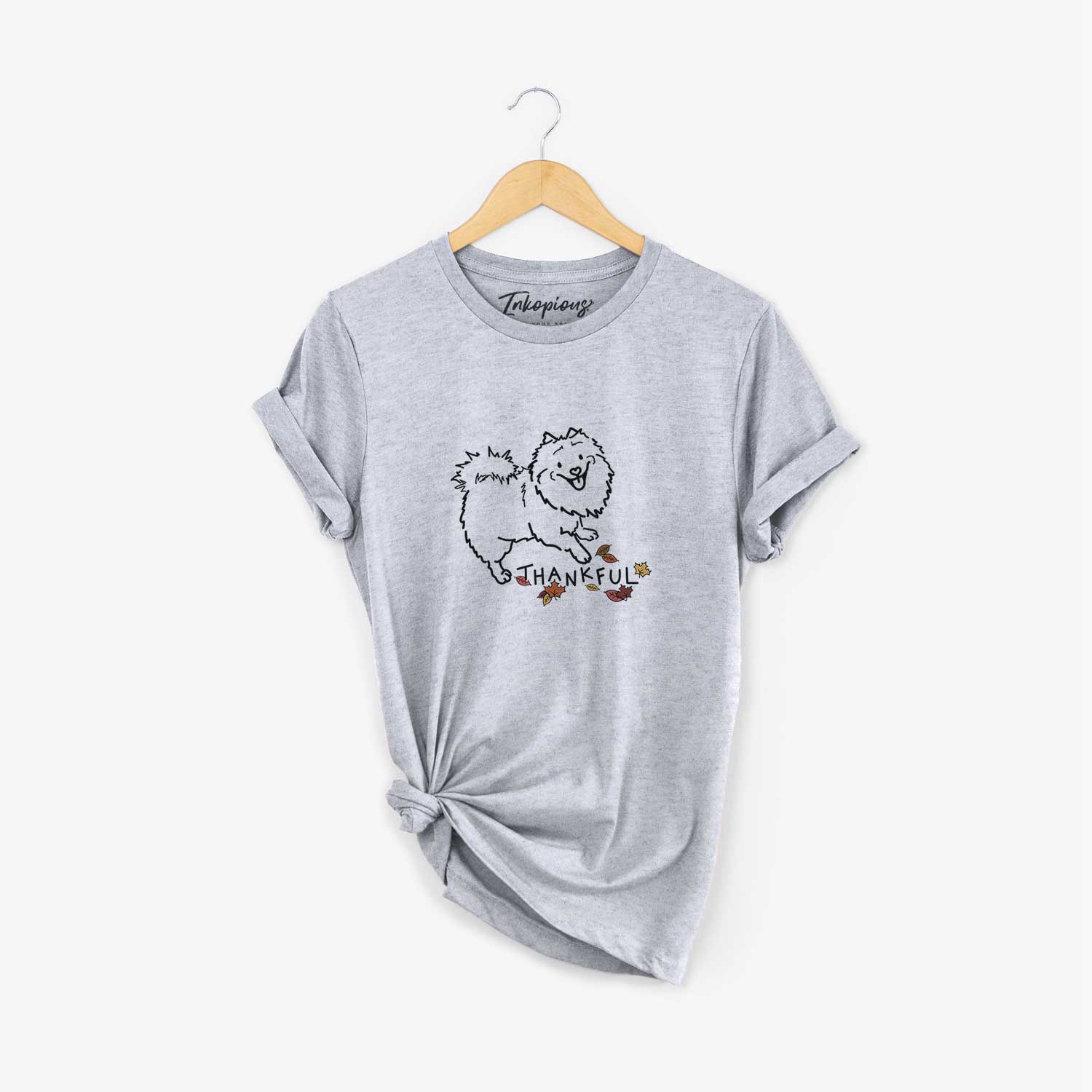 Minimalist line drawing of Goldie the Pomeranian Mix with 'Thankful' lettering on a Grey Unisex crewneck