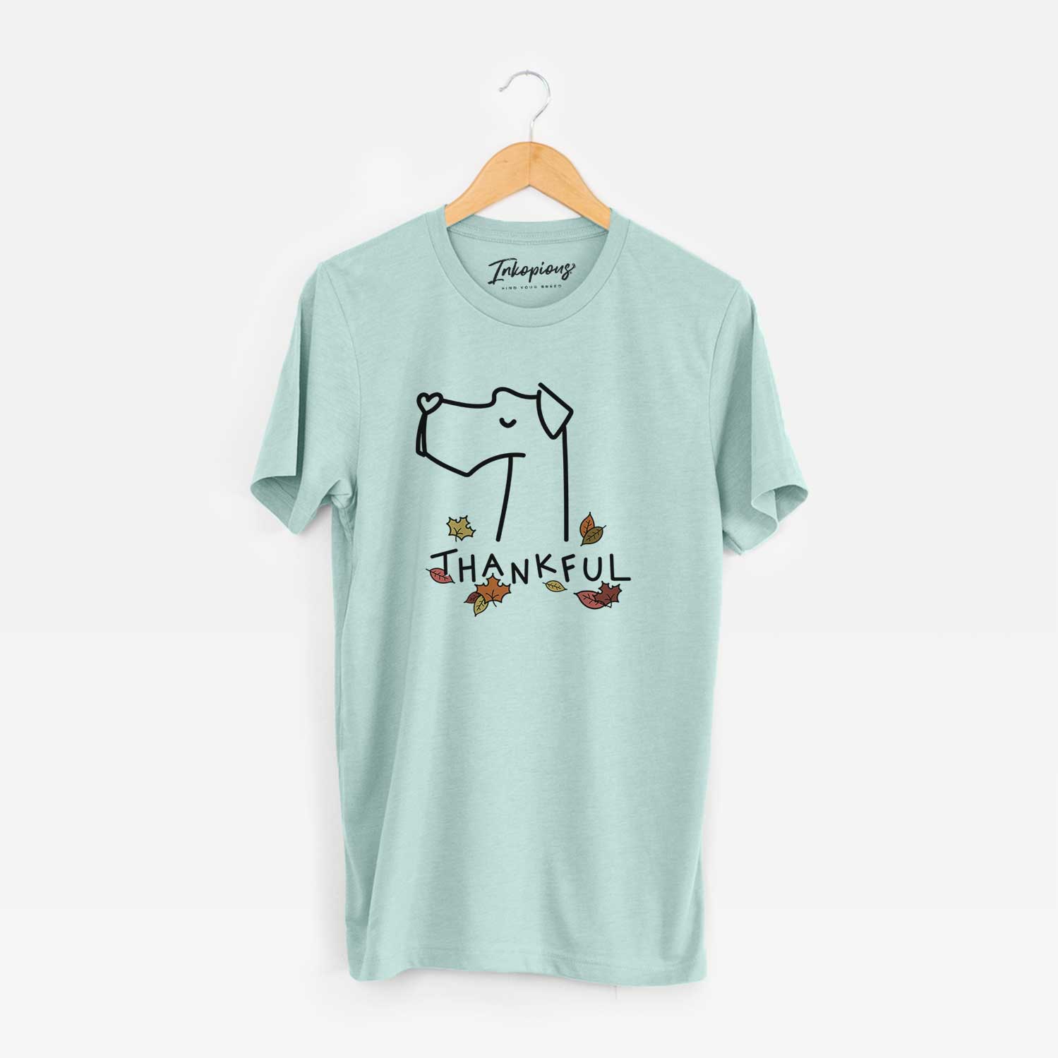 Minimalist line drawing of a Great Dane with 'Thankful' lettering on a Heather Sage Unisex crewneck