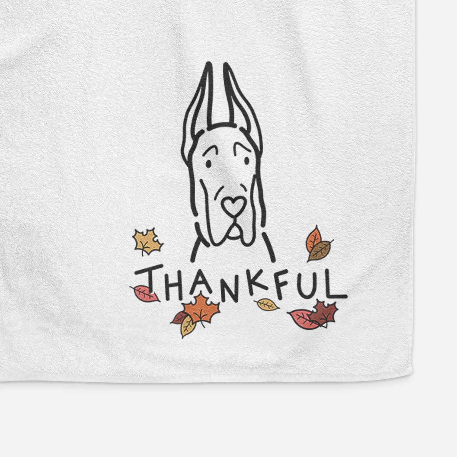 Minimalist line drawing of a Great Dane with Cropped Ears with 'Thankful' lettering on a decorative hand towel
