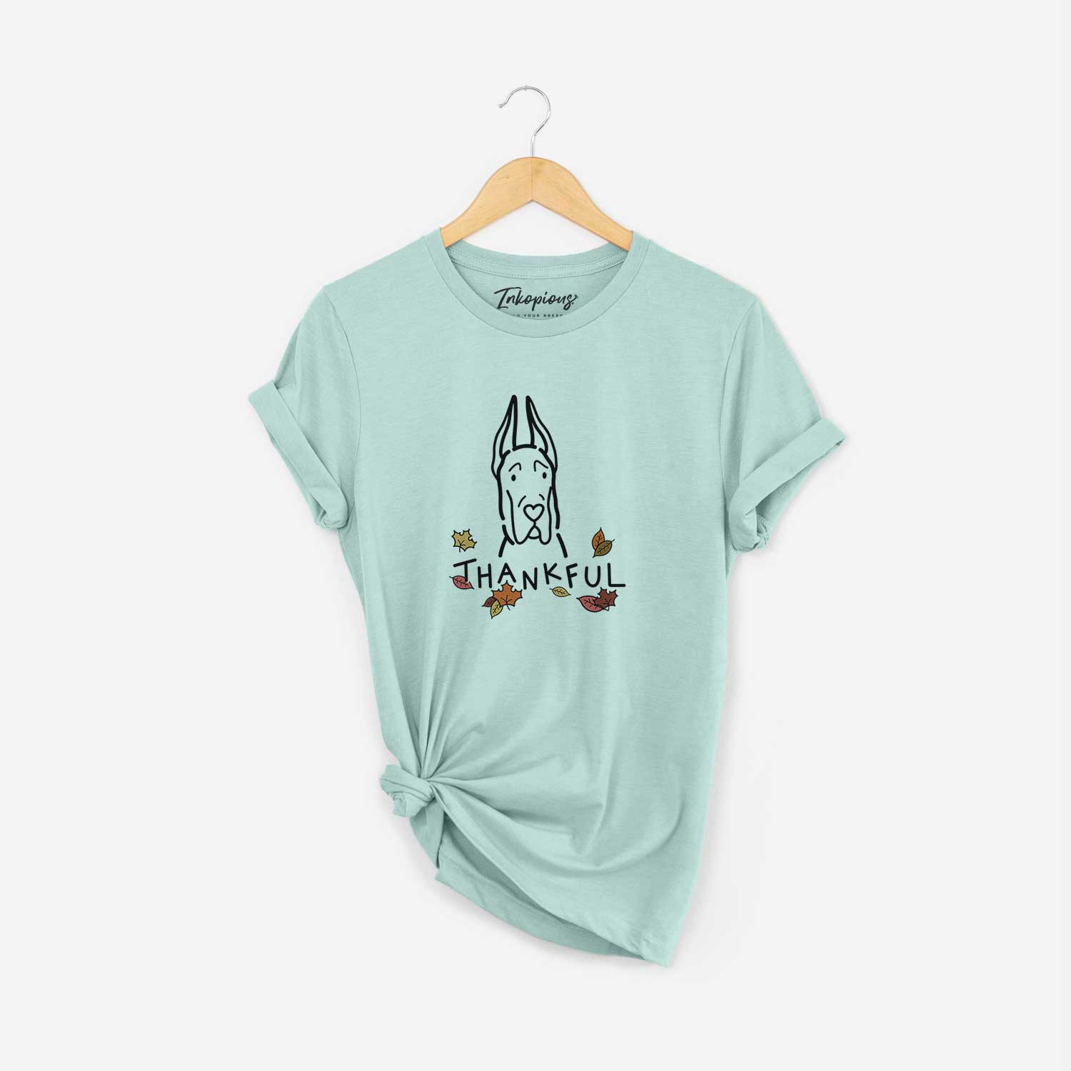 Minimalist line drawing of a Great Dane with Cropped Ears with 'Thankful' lettering on a Heather Sage Unisex crewneck