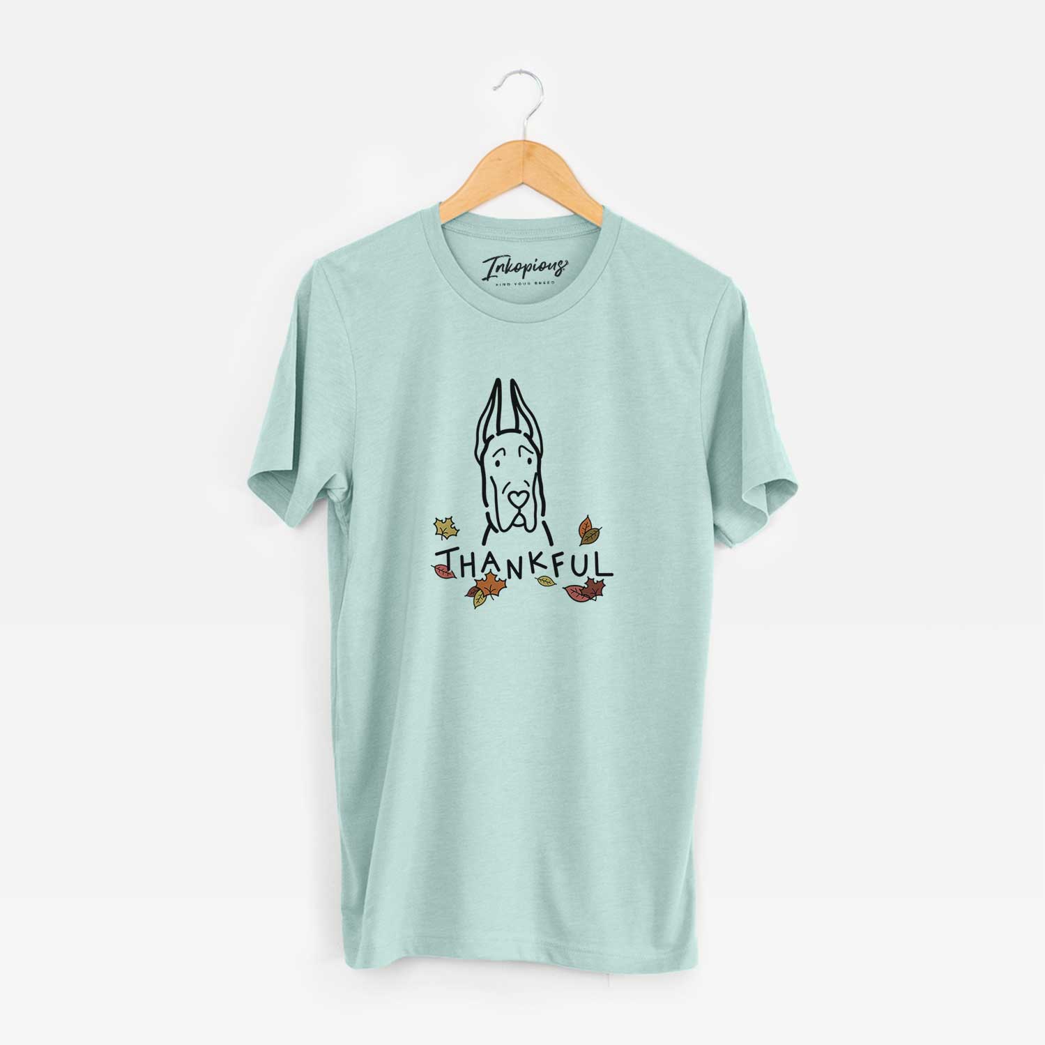 Minimalist line drawing of a Great Dane with Cropped Ears with 'Thankful' lettering on a Heather Sage Unisex crewneck