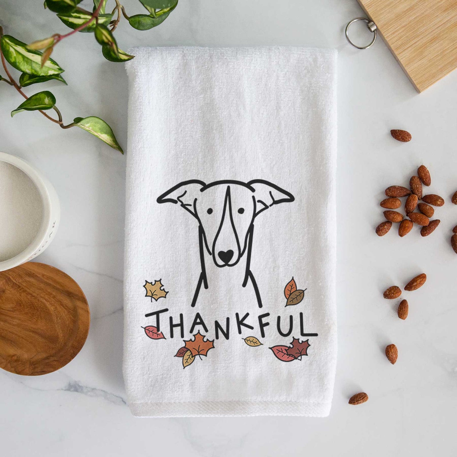 Minimalist line drawing of a Greyhound with 'Thankful' lettering on a decorative hand towel