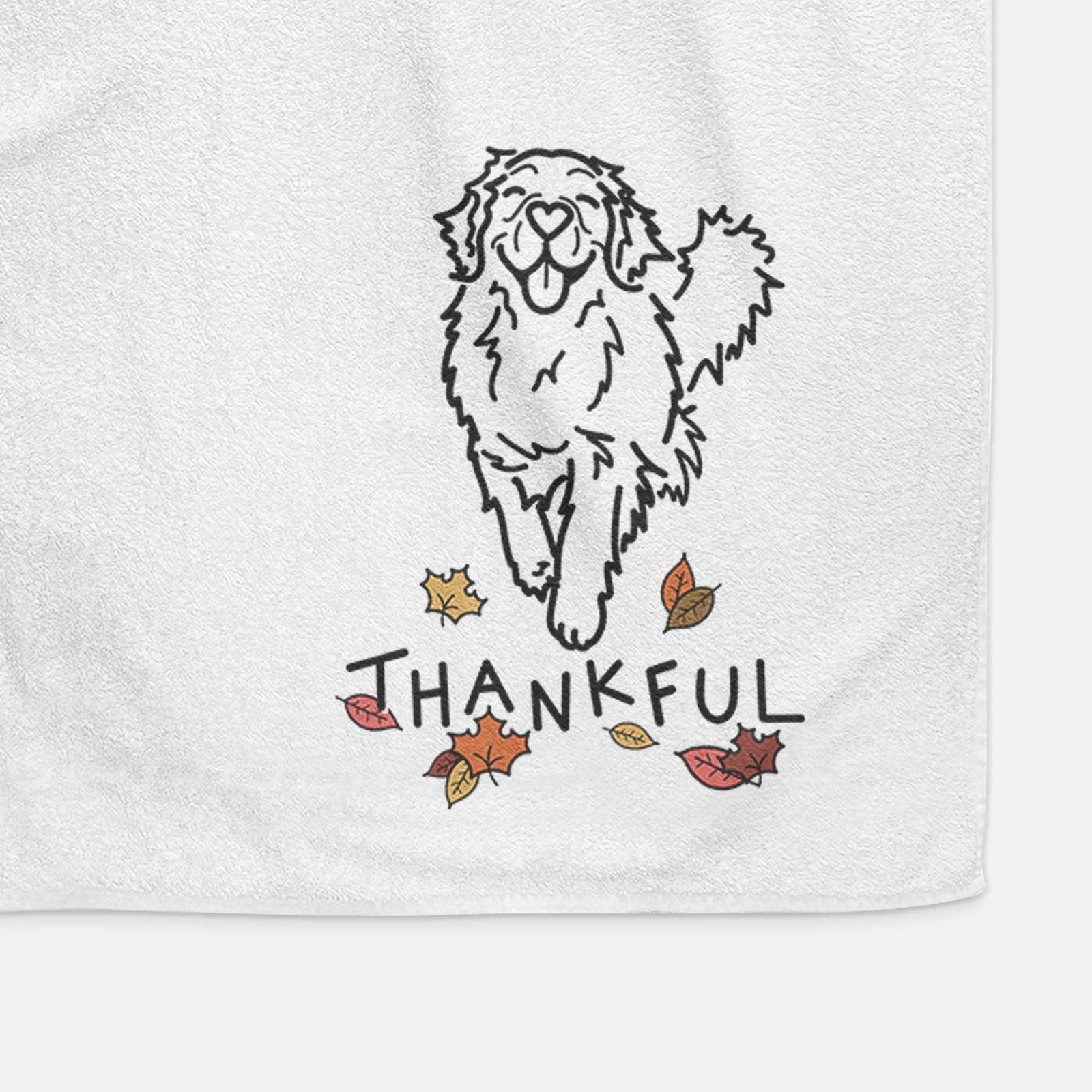 Minimalist line drawing of Hamlet the Golden Retriever with 'Thankful' lettering on a decorative hand towel