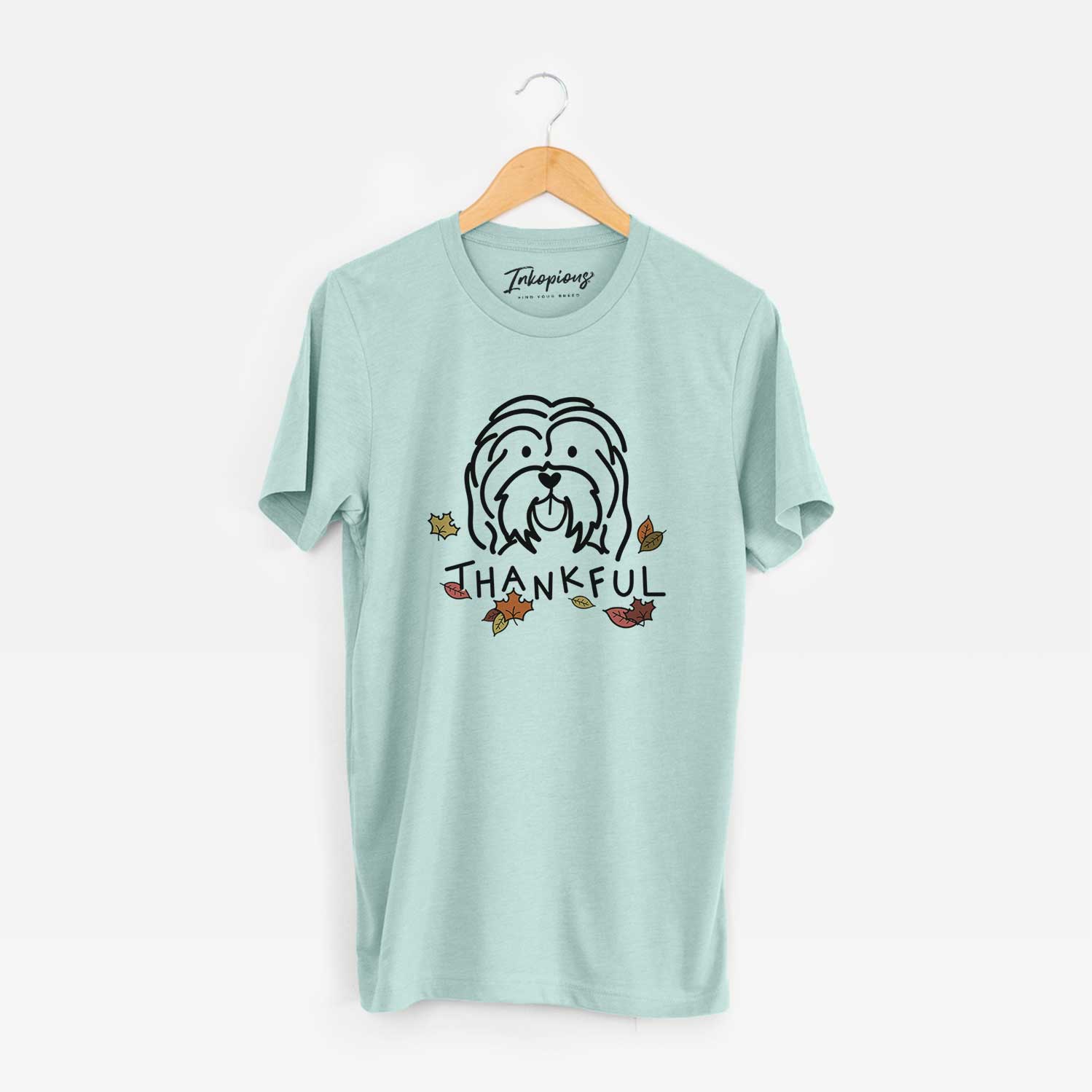Minimalist line drawing of a Havanese with 'Thankful' lettering on a Heather Sage Unisex crewneck